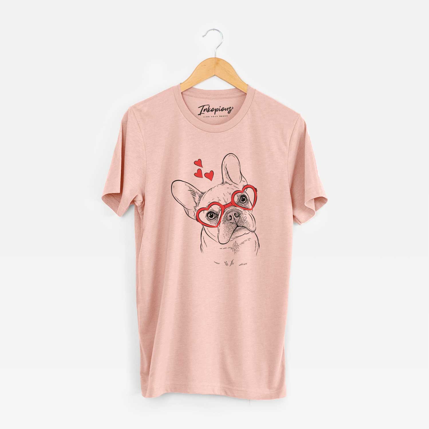 Hand-drawn sketch of Loki the French Bulldog wearing heart-shaped glasses on a Peach Unisex crewneck