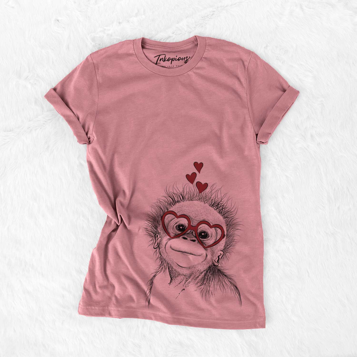 Hand-drawn sketch of Louie the Baby Orangutan wearing heart-shaped glasses on a Mauve Bella Canvas Unisex Crewneck