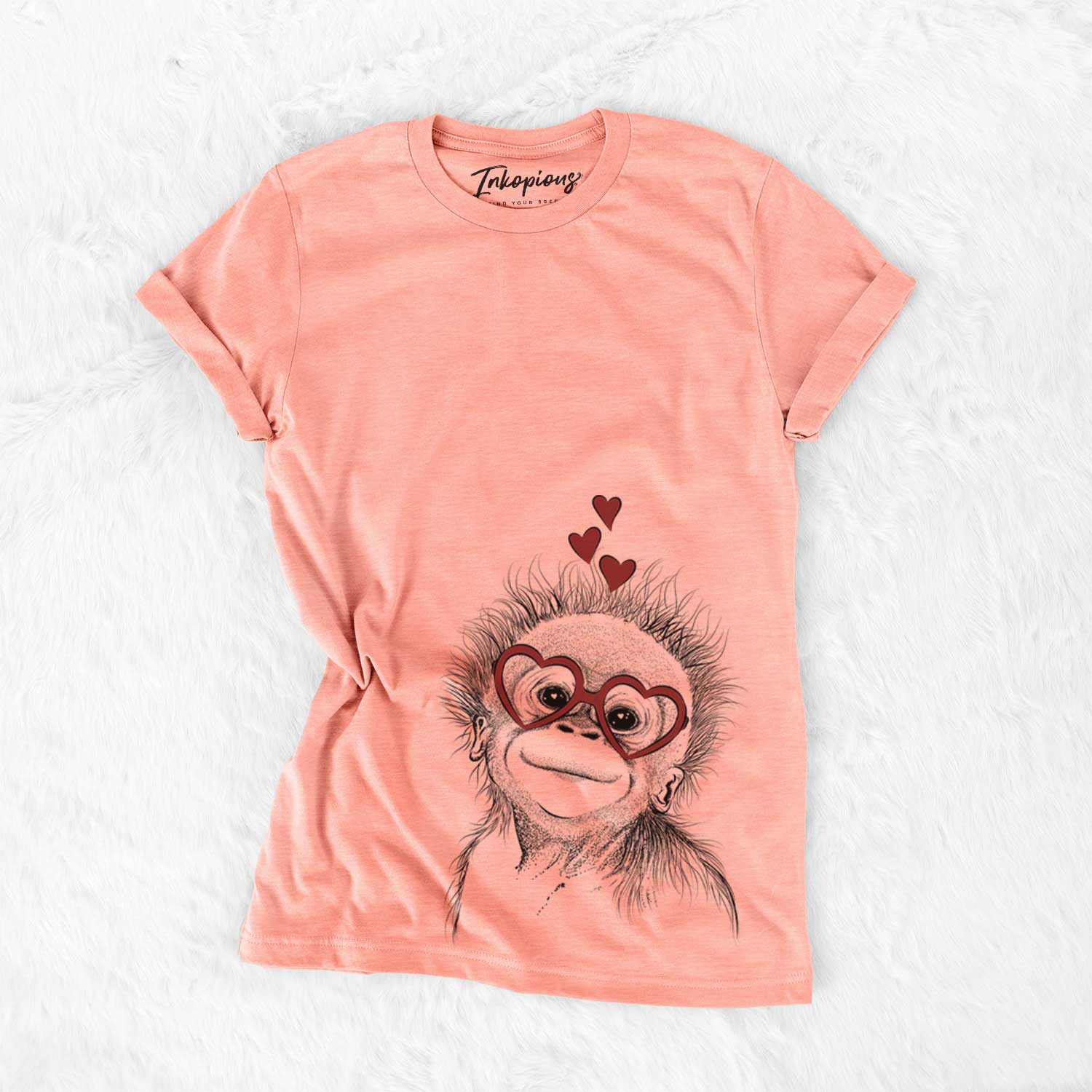 Hand-drawn sketch of Louie the Baby Orangutan wearing heart-shaped glasses on a Sunset Bella Canvas Unisex Crewneck