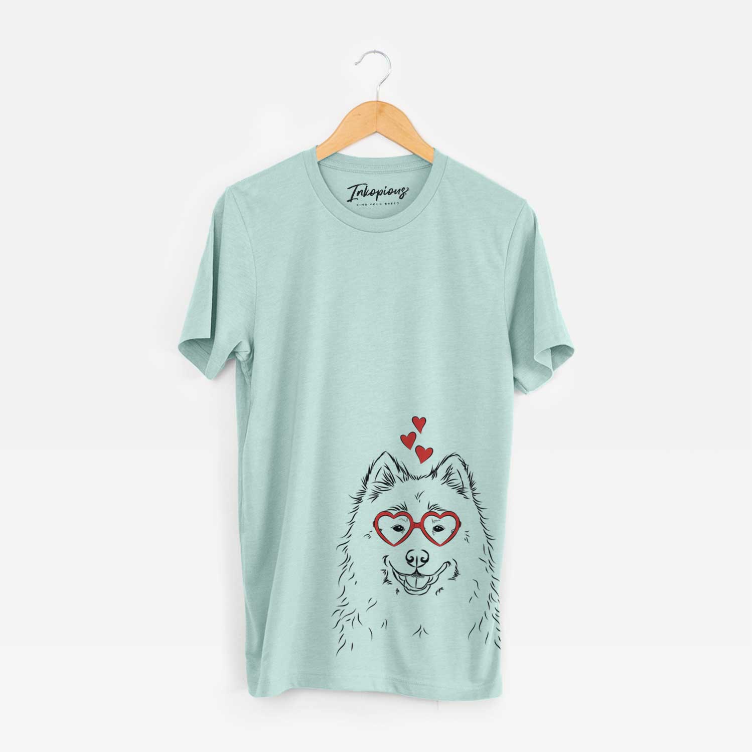 Hand-drawn sketch of Luka the Samoyed wearing heart-shaped glasses on a Heather Sage Bella Canvas Unisex Crewneck