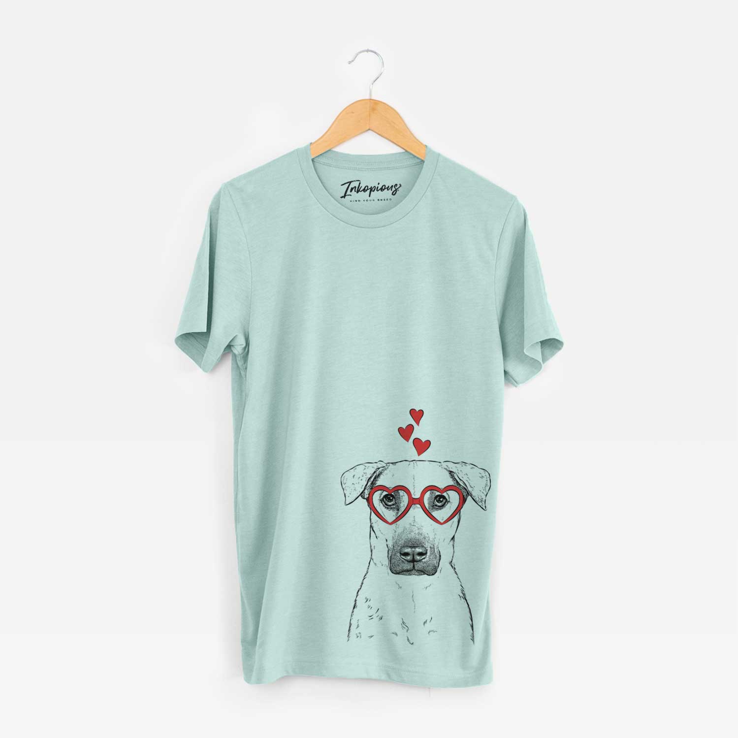 Hand-drawn sketch of Luna the Black Mouth Cur wearing heart-shaped glasses on a Heather Sage Unisex crewneck