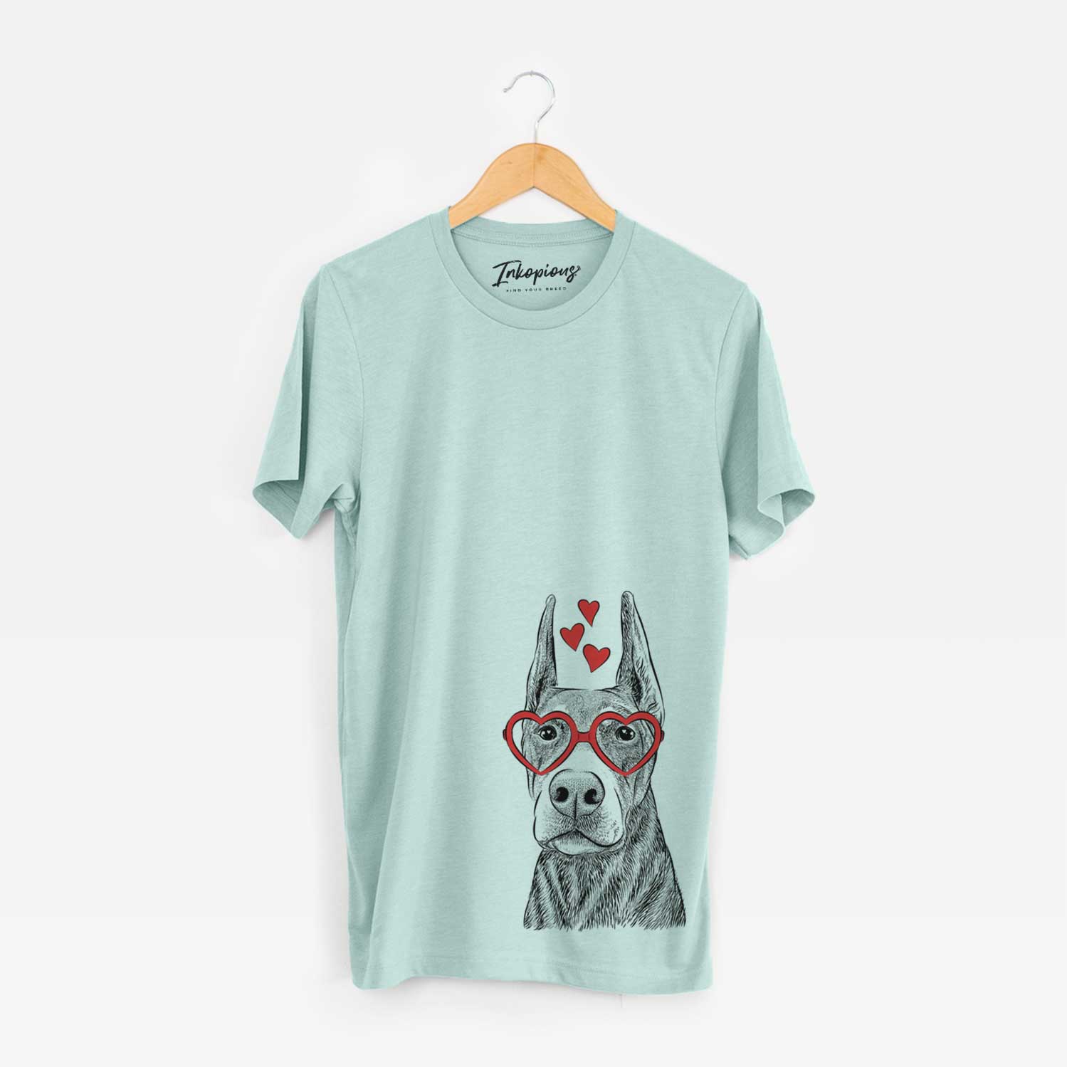 Hand-drawn sketch of Luna the Doberman Pinscher wearing heart-shaped glasses on a Heather Sage Unisex crewneck