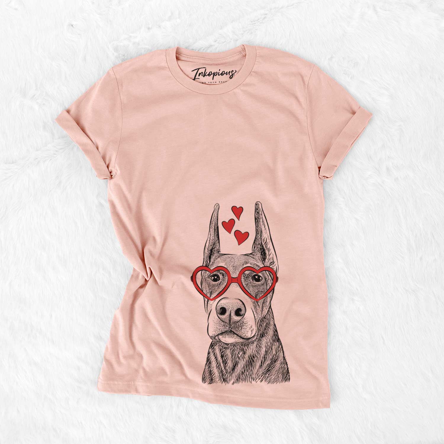 Hand-drawn sketch of Luna the Doberman Pinscher wearing heart-shaped glasses on a Peach Bella Canvas Unisex Crewneck