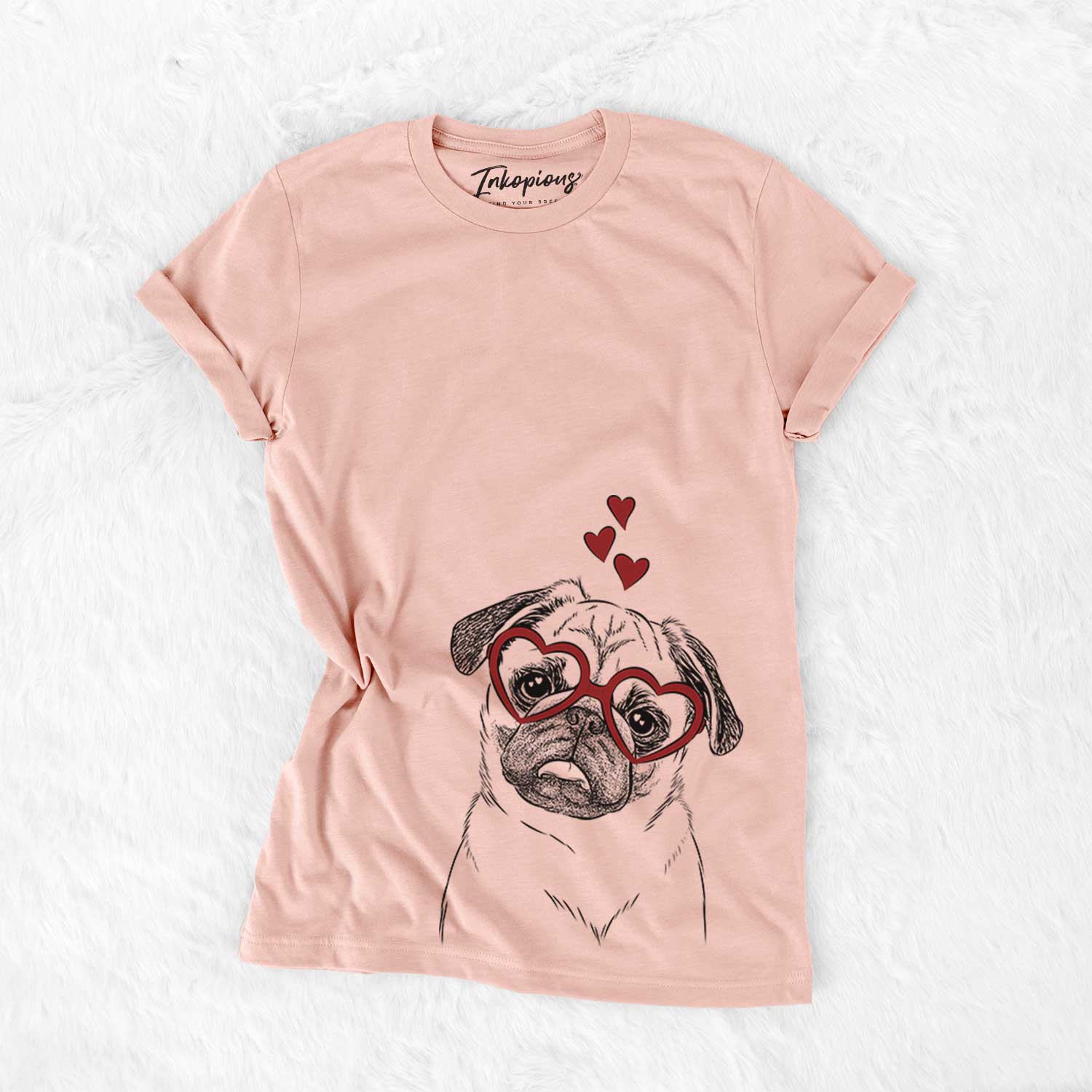 Hand-drawn sketch of Macy the Pug wearing heart-shaped glasses on a Peach Bella Canvas Unisex Crewneck