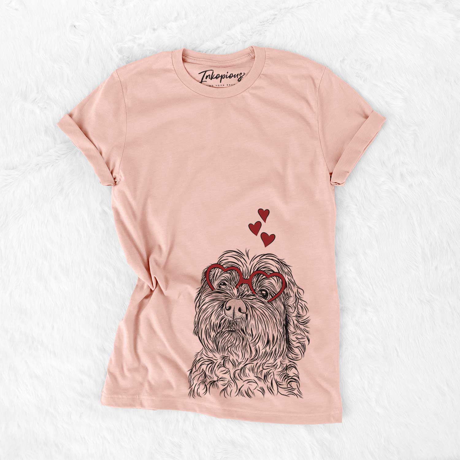 Hand-drawn sketch of Maggie Girl the Cockapoo wearing heart-shaped glasses on a Peach Bella Canvas Unisex Crewneck
