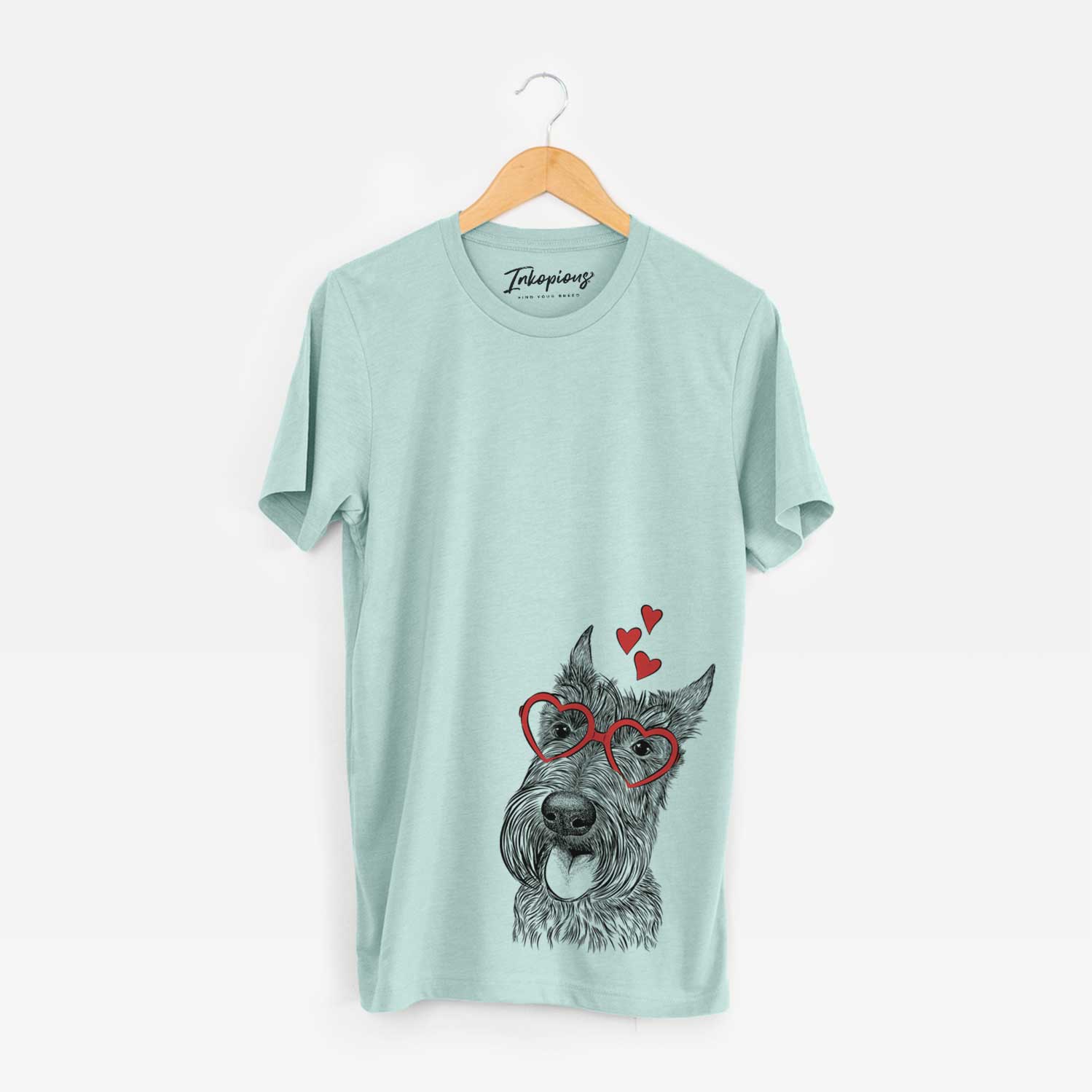 Hand-drawn sketch of Magnus the Scottish Terrier wearing heart-shaped glasses on a Heather Sage Unisex crewneck