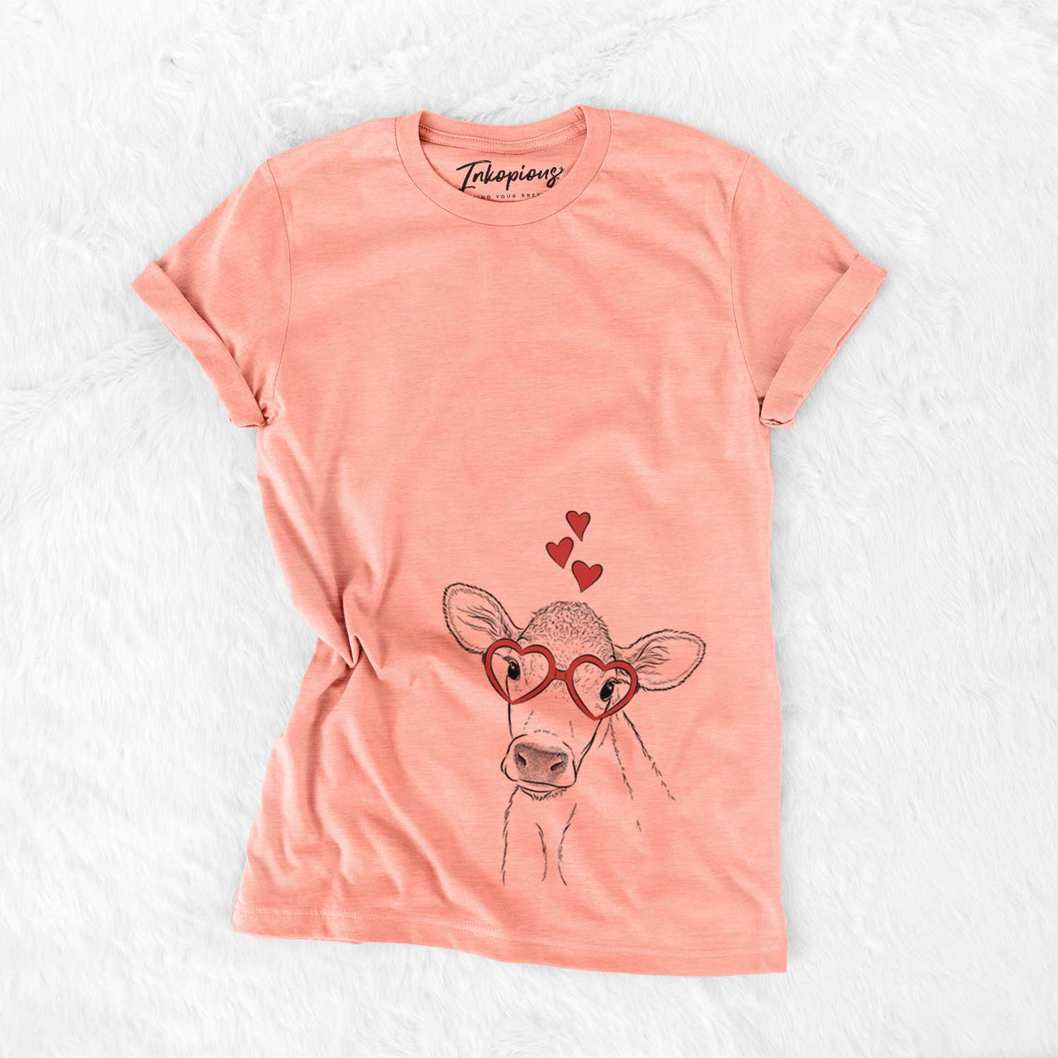 Hand-drawn sketch of Malu the Cow wearing heart-shaped glasses on a Sunset Bella Canvas Unisex Crewneck
