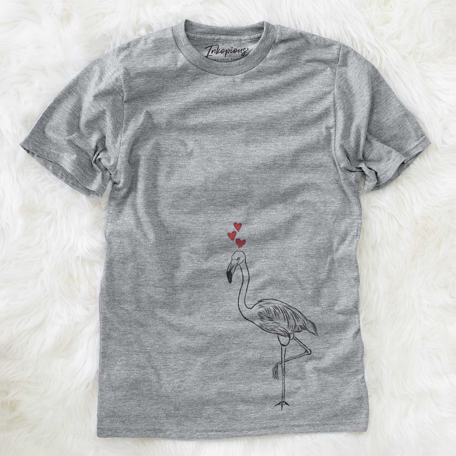 Hand-drawn sketch of Mango the Flamingo wearing heart-shaped glasses on a Grey Unisex crewneck