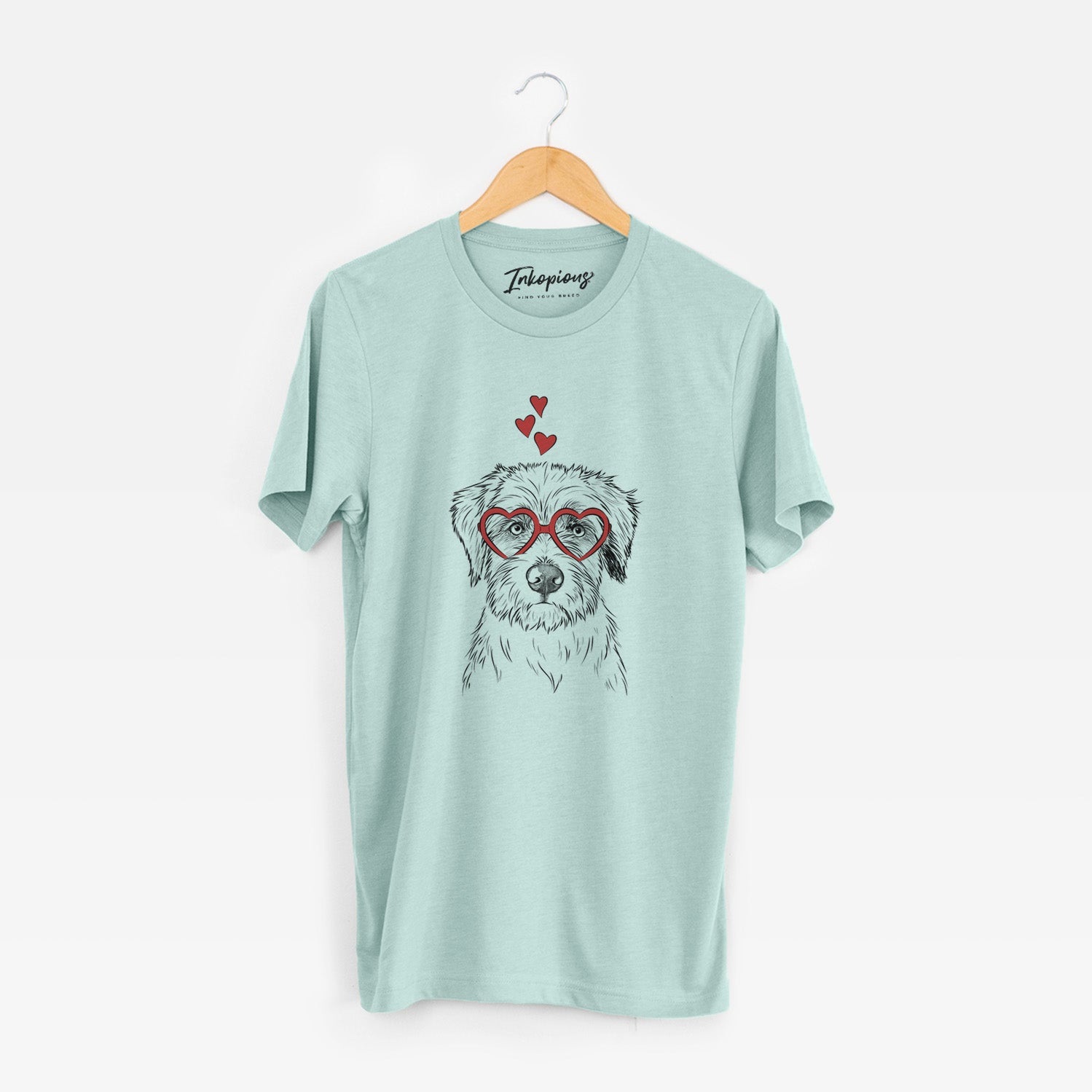 Hand-drawn sketch of Marek the Bernedoodle wearing heart-shaped glasses on a Heather Sage Unisex crewneck