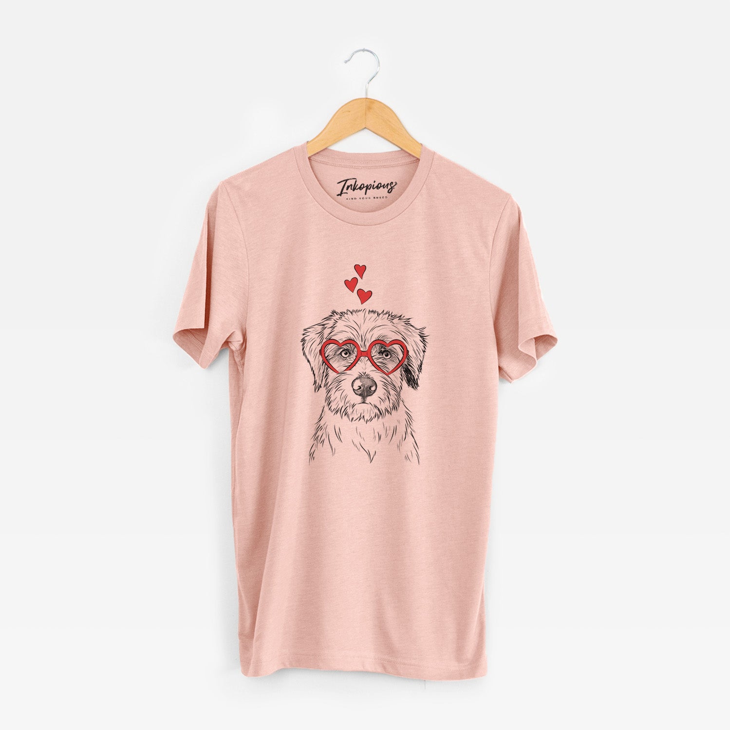 Hand-drawn sketch of Marek the Bernedoodle wearing heart-shaped glasses on a Peach Unisex crewneck