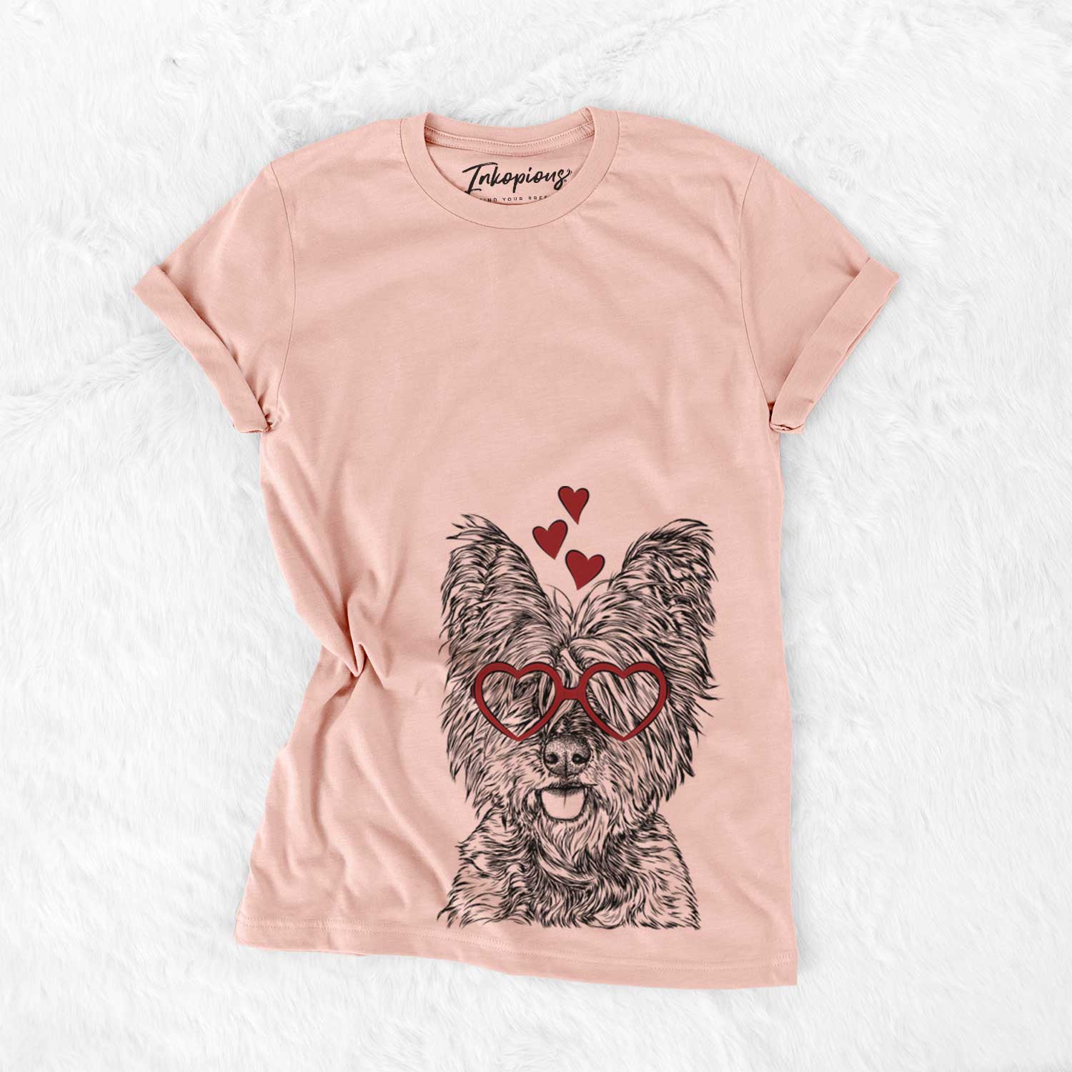 Hand-drawn sketch of McDuff the Cairn Terrier wearing heart-shaped glasses on a Peach Bella Canvas Unisex Crewneck