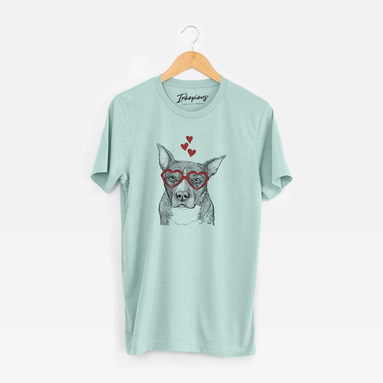 Hand-drawn sketch of Mercy the Pitbull wearing heart-shaped glasses on a Heather Sage Unisex crewneck