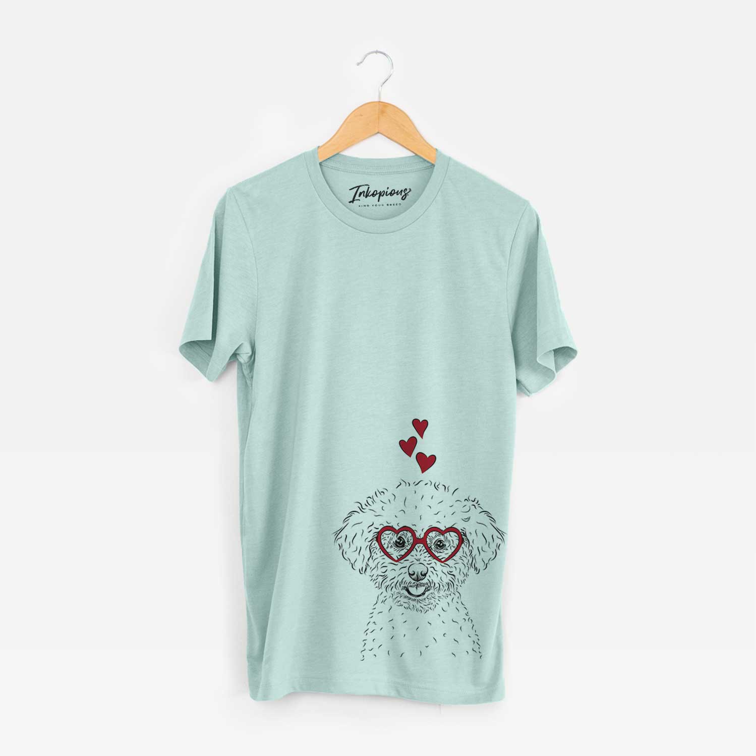 Hand-drawn sketch of Mickey the Bichon Frise wearing heart-shaped glasses on a Heather Sage Bella Canvas Unisex Crewneck