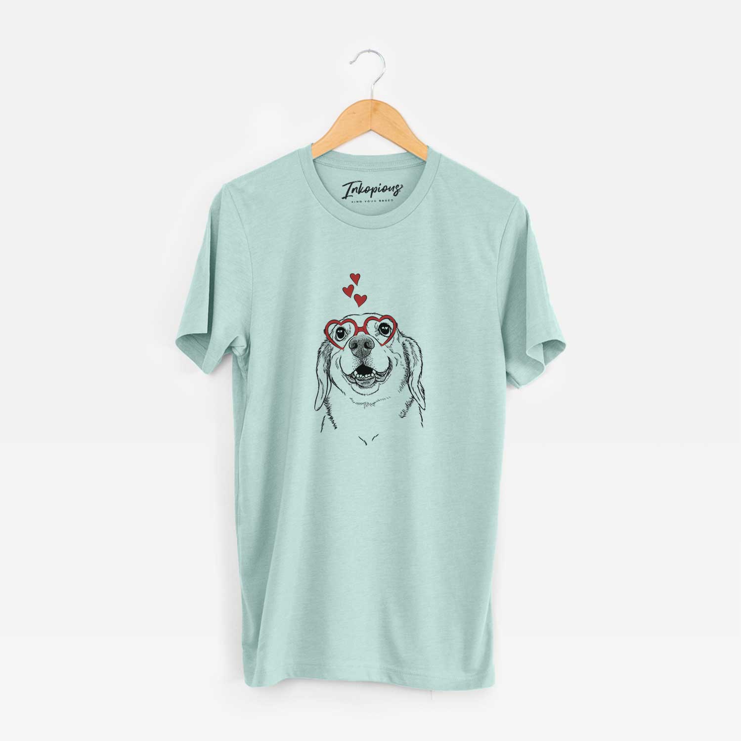 Hand-drawn sketch of Minnie the Corgle wearing heart-shaped glasses on a Heather Sage Unisex crewneck
