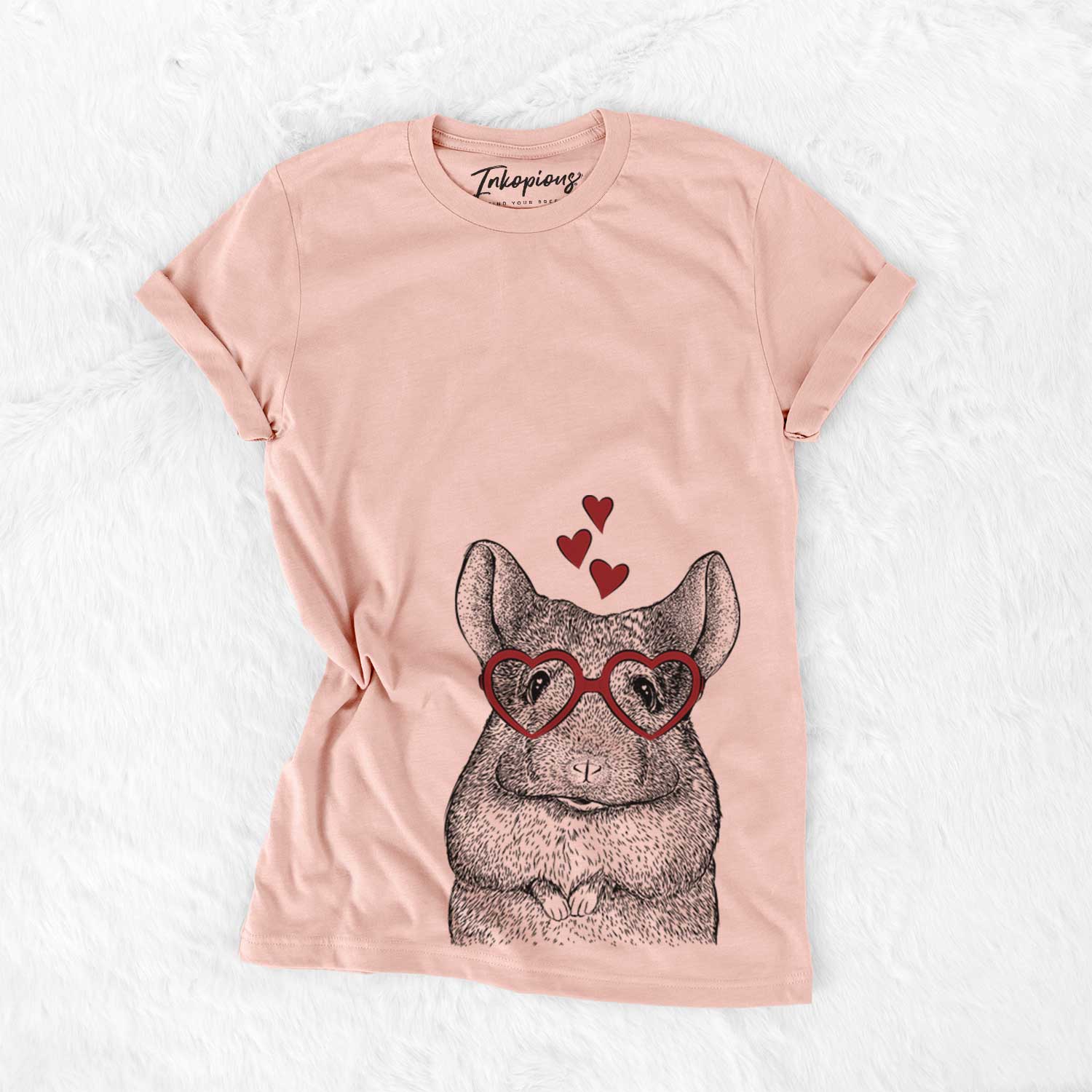 Hand-drawn sketch of Mojo the Chinchilla wearing heart-shaped glasses on a Peach Bella Canvas Unisex Crewneck