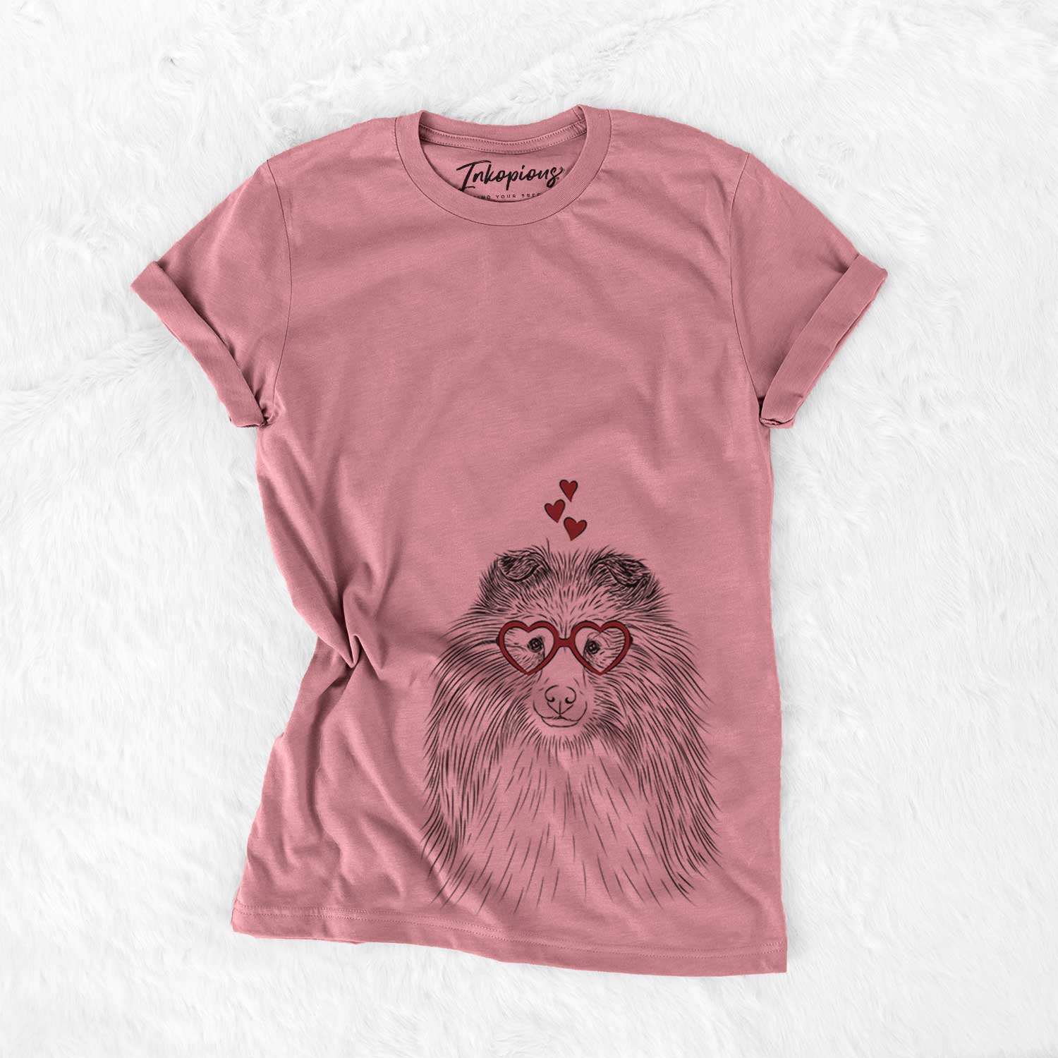 Hand-drawn sketch of Moxie the Shetland Sheepdog wearing heart-shaped glasses on a Mauve Bella Canvas Unisex Crewneck