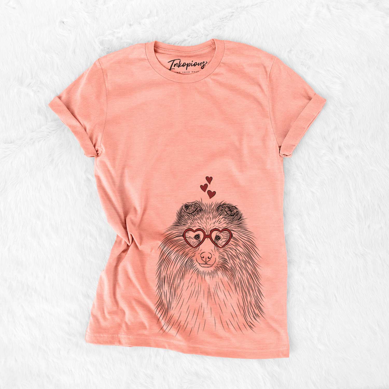 Hand-drawn sketch of Moxie the Shetland Sheepdog wearing heart-shaped glasses on a Sunset Bella Canvas Unisex Crewneck