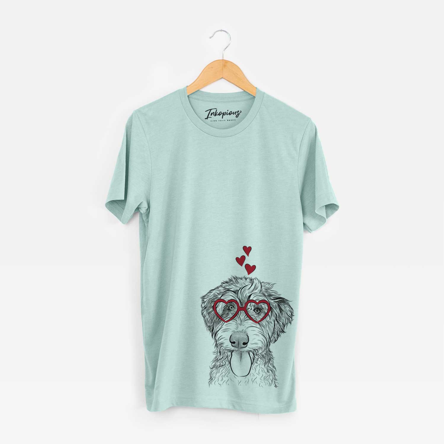 Hand-drawn sketch of Myrtle Mae the Aussiedoodle wearing heart-shaped glasses on a Heather Sage Bella Canvas Unisex Crewneck