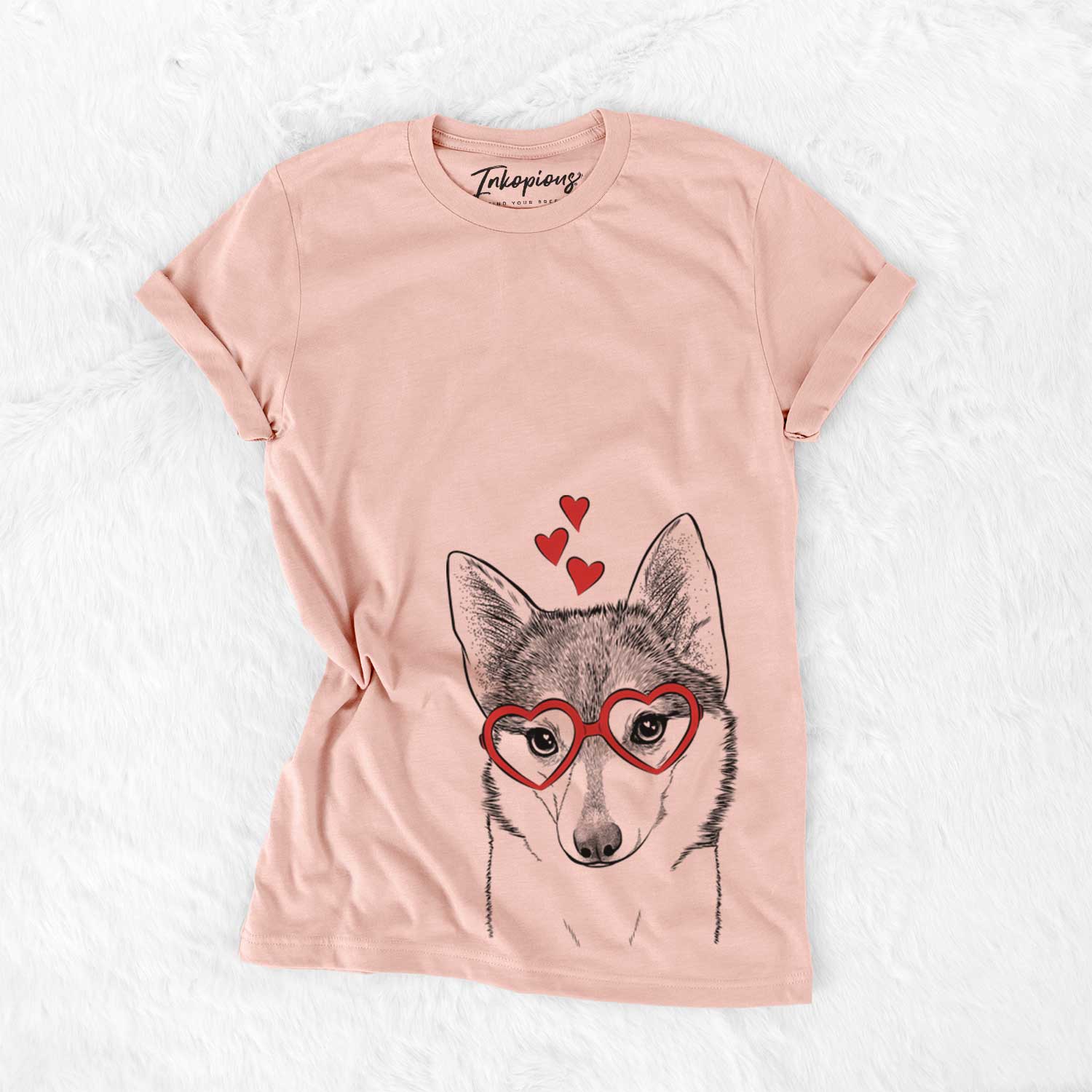 Hand-drawn sketch of Nami the Alaskan Klee Kai wearing heart-shaped glasses on a Peach Bella Canvas Unisex Crewneck