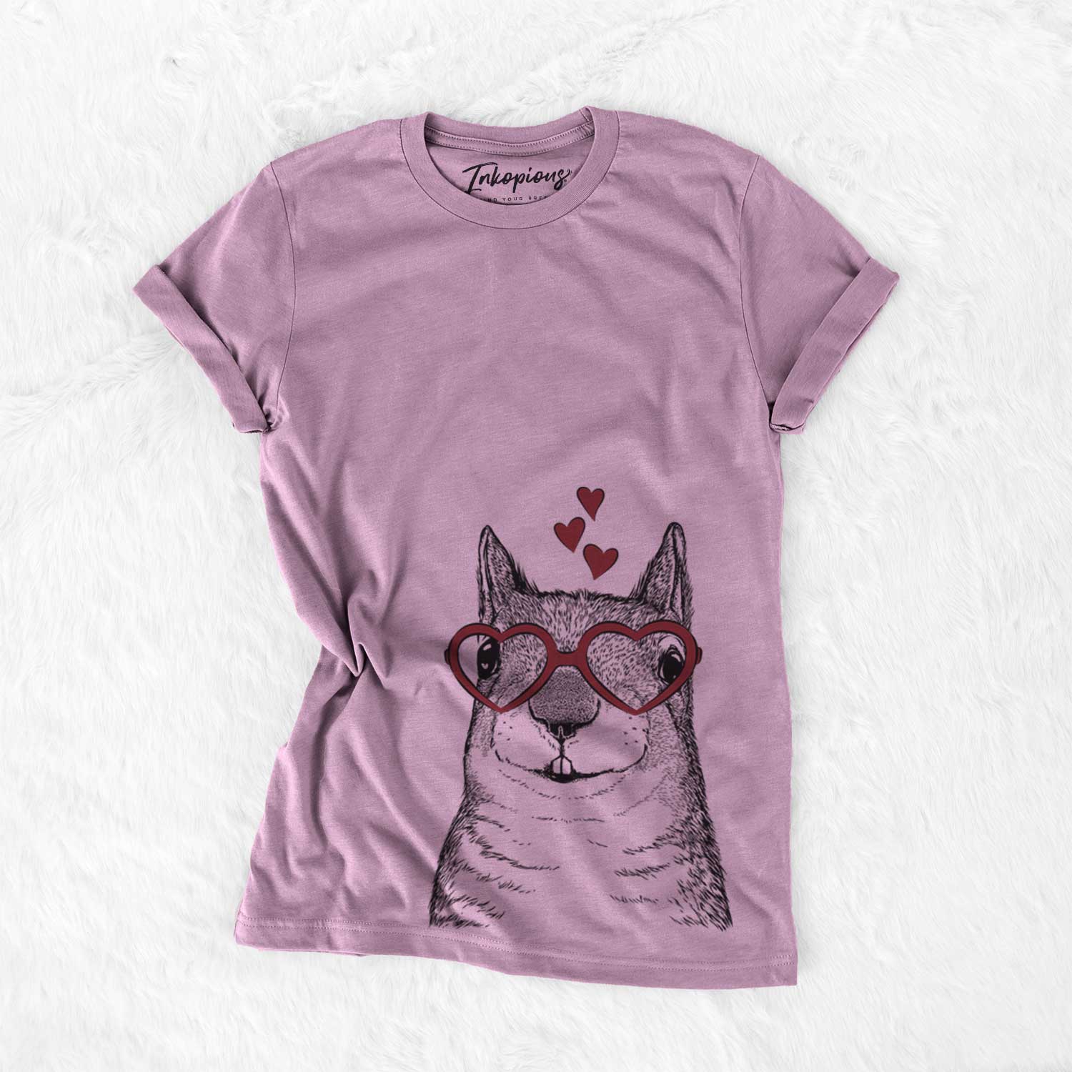 Hand-drawn sketch of Nibbles the Squirrel wearing heart-shaped glasses on an Orchid Bella Canvas Unisex Crewneck