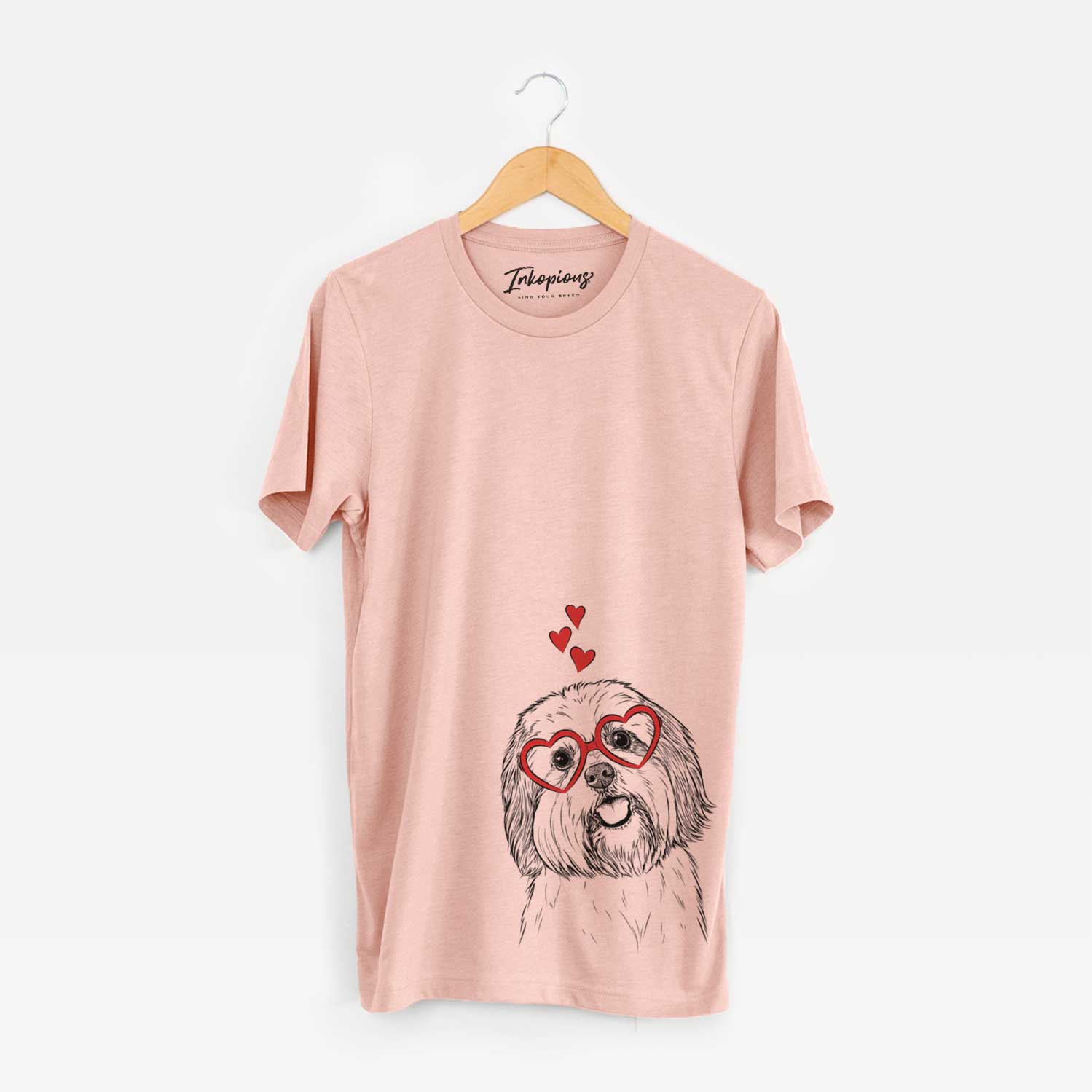 Hand-drawn sketch of Nikka the Lowchen wearing heart-shaped glasses on a Peach Unisex crewneck