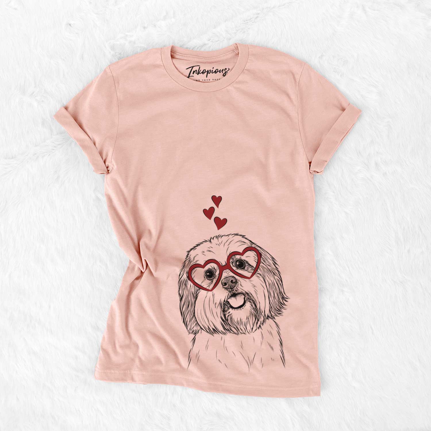 Hand-drawn sketch of Nikka the Lowchen wearing heart-shaped glasses on a Peach Bella Canvas Unisex Crewneck