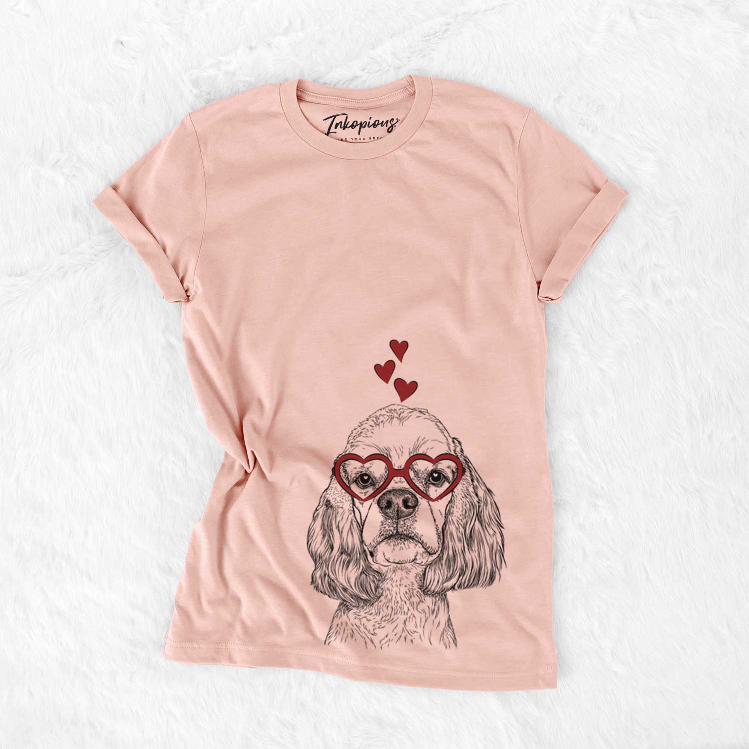 Hand-drawn sketch of Oakley the American Cocker Spaniel wearing heart-shaped glasses on a Peach Bella Canvas Unisex Crewneck
