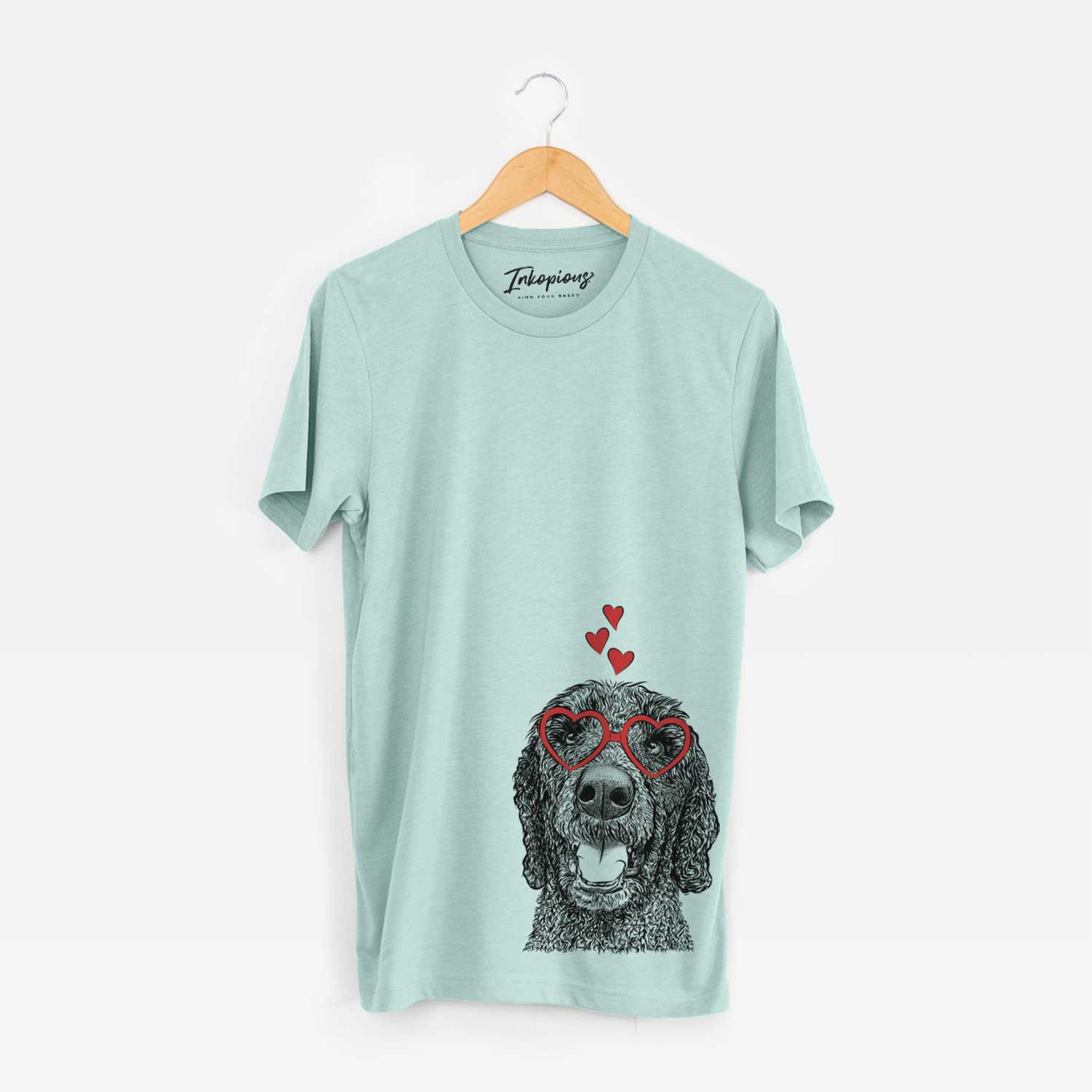Hand-drawn sketch of Obi James the Goldendoodle wearing heart-shaped glasses on a Heather Sage Unisex crewneck
