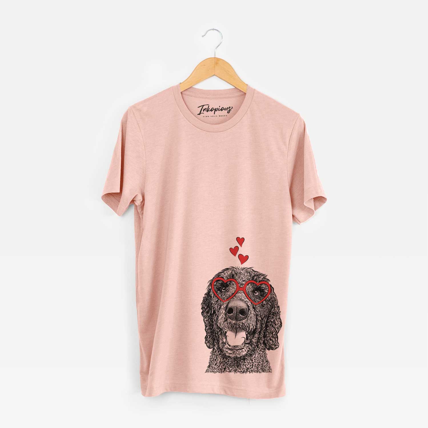 Hand-drawn sketch of Obi James the Goldendoodle wearing heart-shaped glasses on a Peach Unisex crewneck