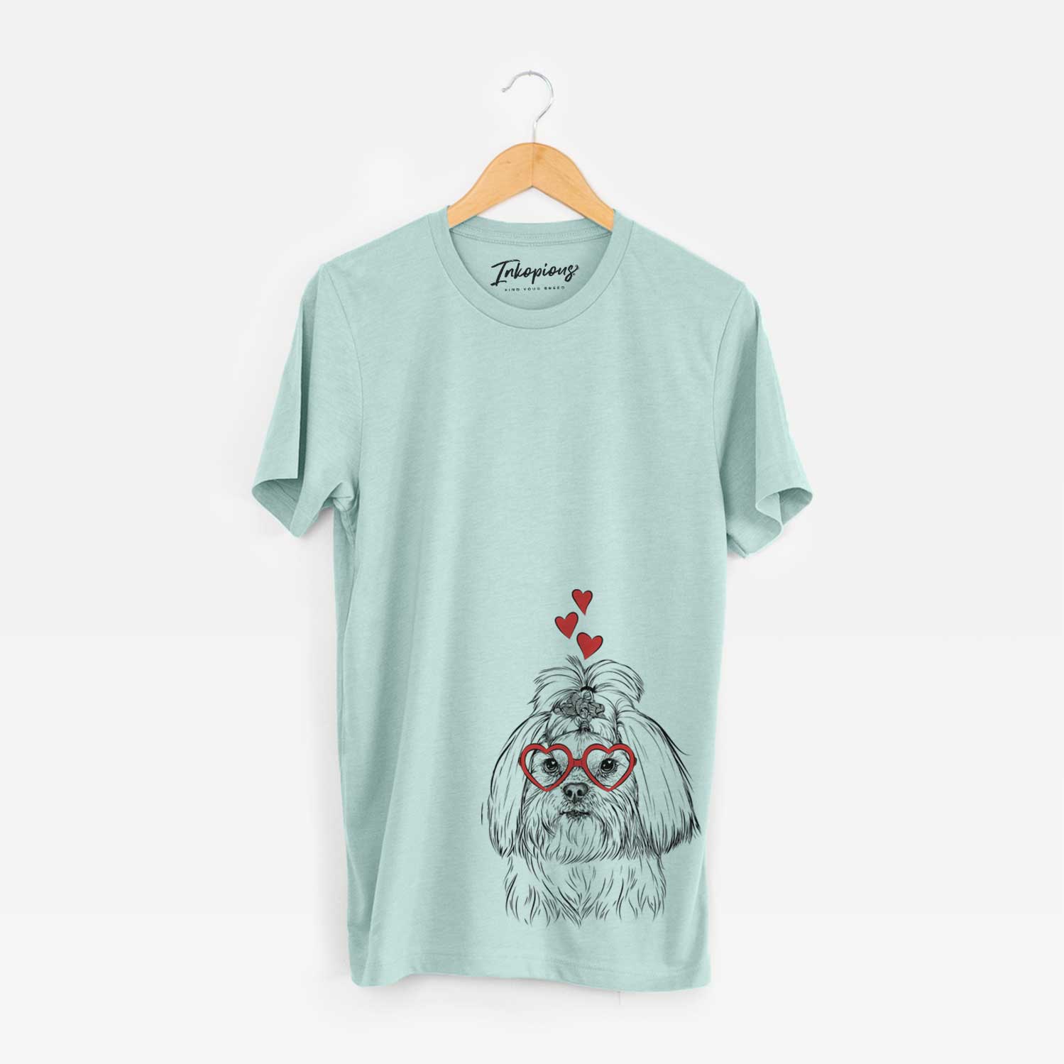 Hand-drawn sketch of Olga the Shih Tzu wearing heart-shaped glasses on a Heather Sage Unisex crewneck