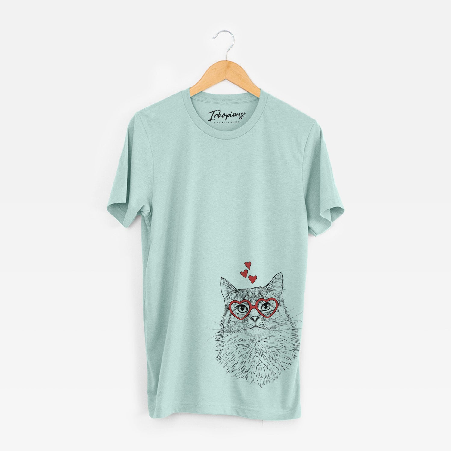 Hand-drawn sketch of Olive the Cat wearing heart-shaped glasses on a Heather Sage Unisex crewneck