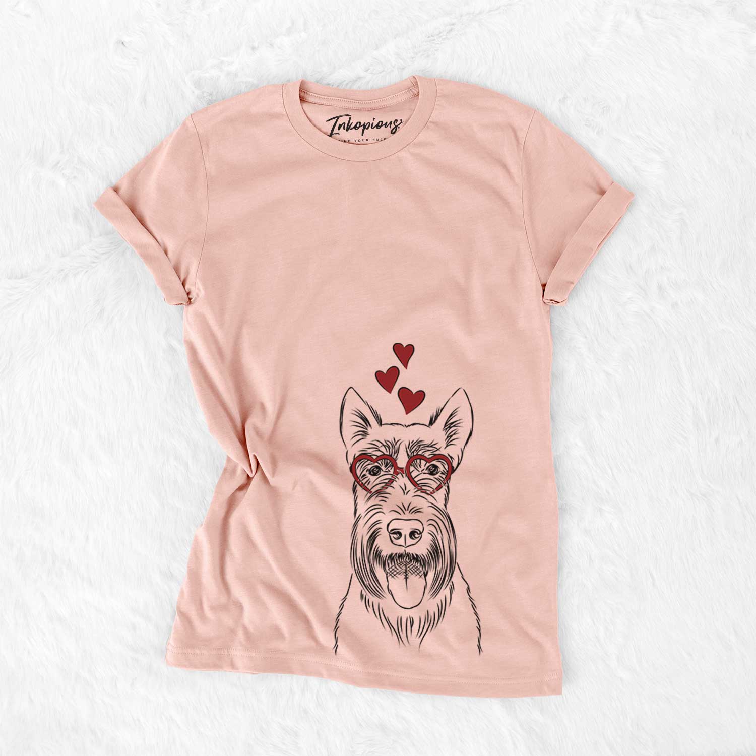 Hand-drawn sketch of Oswald the Scottish Terrier wearing heart-shaped glasses on a Peach Bella Canvas Unisex Crewneck