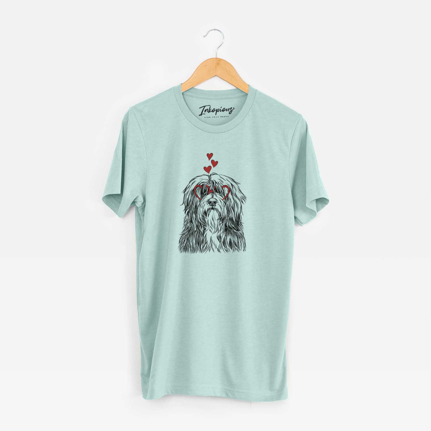 Hand-drawn sketch of Otto the Polish Lowland Sheepdog wearing heart-shaped glasses on a Heather Sage Unisex crewneck