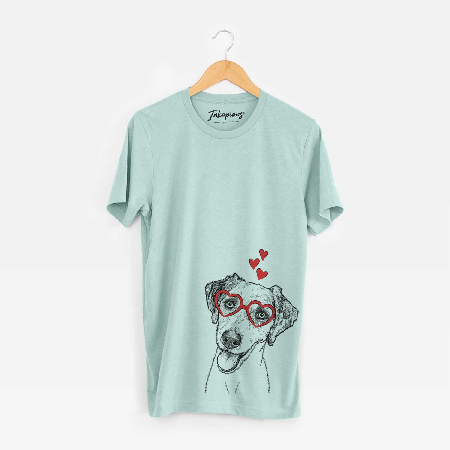 Hand-drawn sketch of Palm Palm the Aussiedoodle wearing heart-shaped glasses on a Heather Sage Unisex crewneck