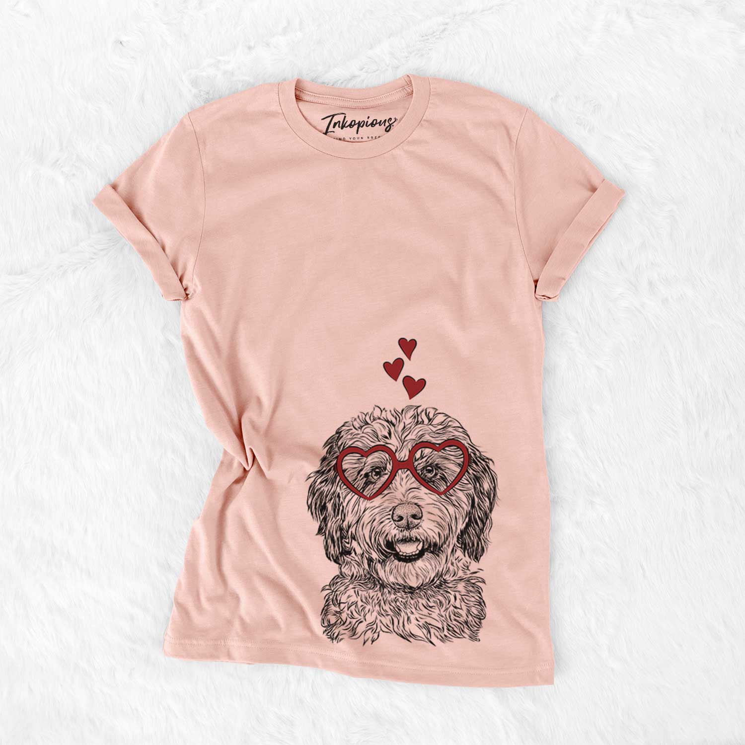 Hand-drawn sketch of Palmer the Aussiedoodle wearing heart-shaped glasses on a Peach Bella Canvas Unisex Crewneck
