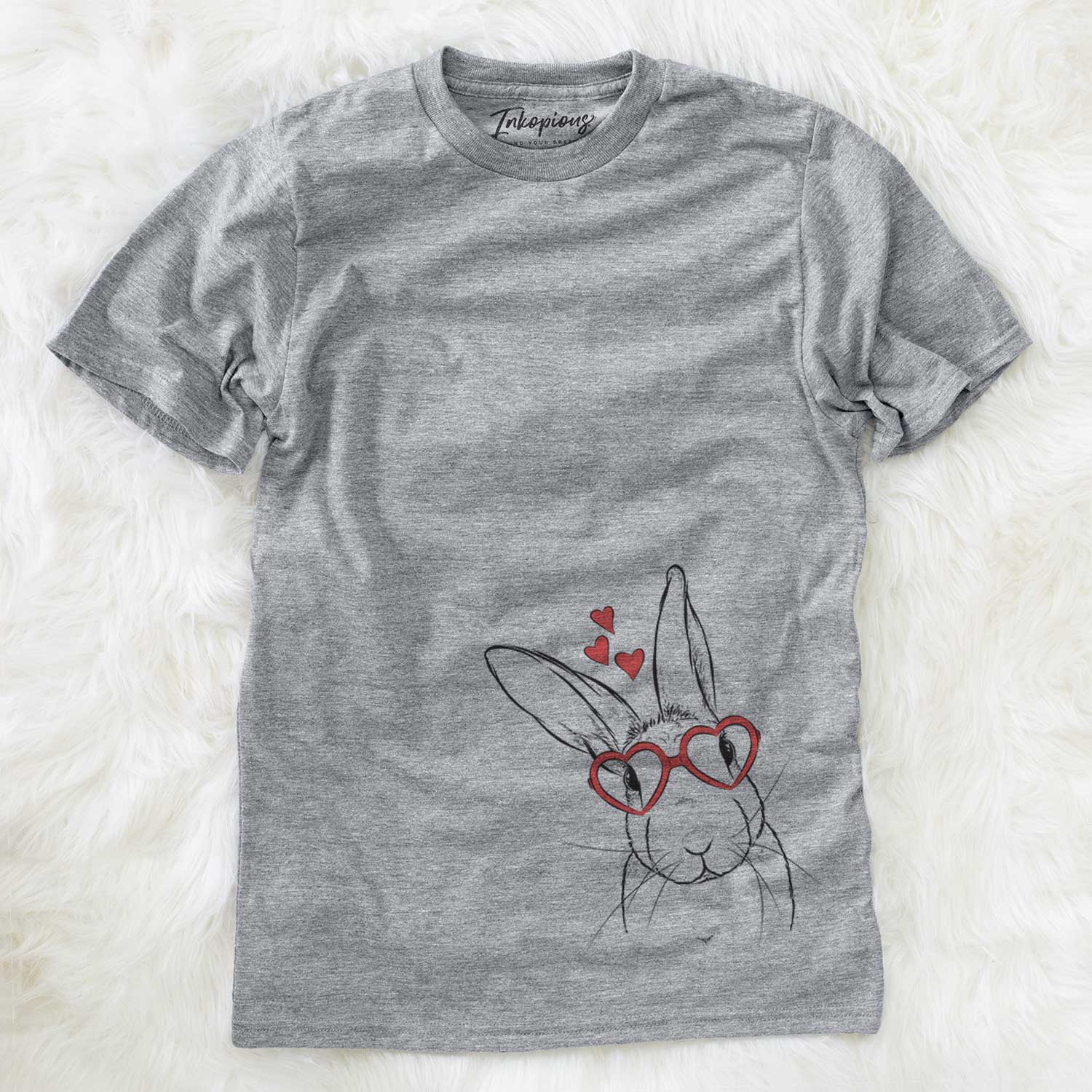 Hand-drawn sketch of Penny the Belgian Hare wearing heart-shaped glasses on a Grey Unisex crewneck