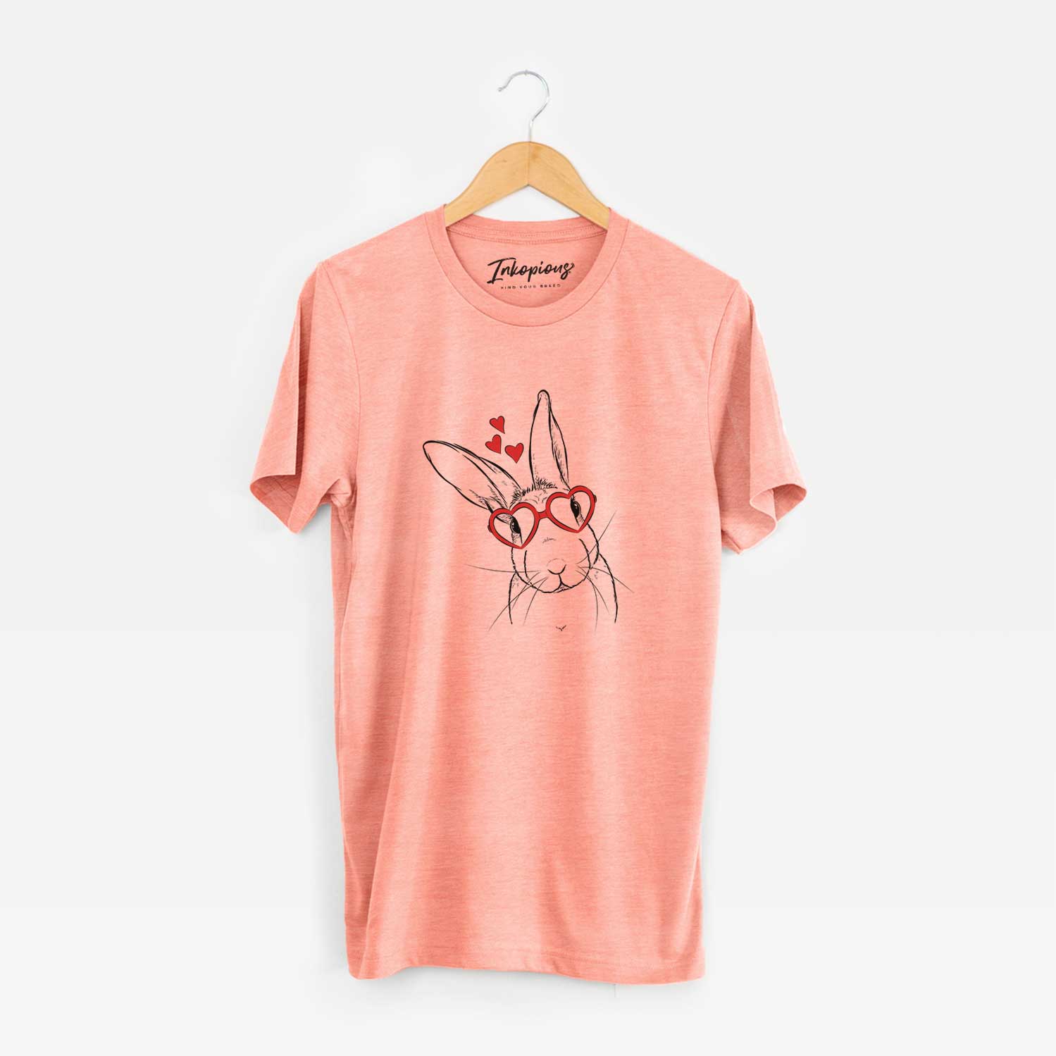 Hand-drawn sketch of Penny the Belgian Hare wearing heart-shaped glasses on a Sunset Unisex crewneck