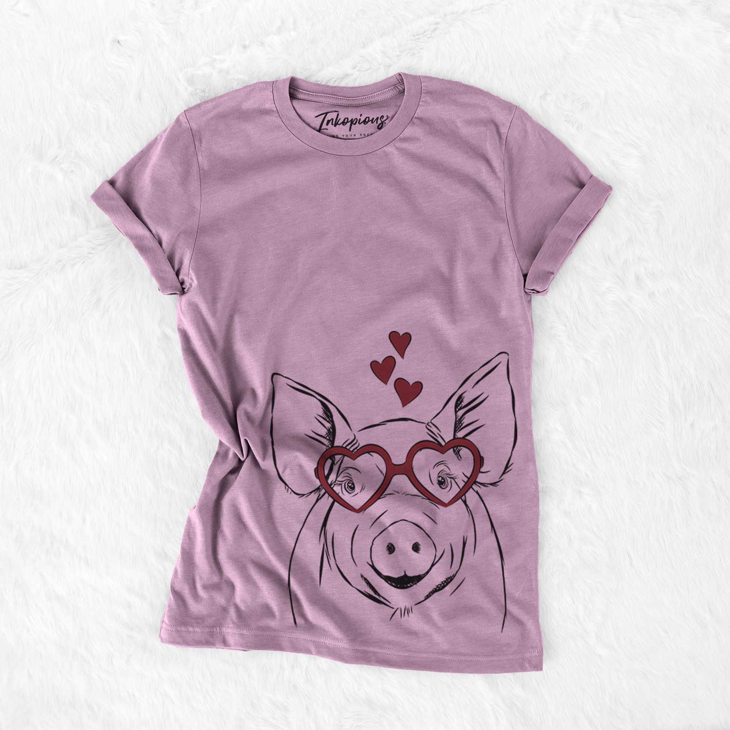 Hand-drawn sketch of Perry the Pig wearing heart-shaped glasses on an Orchid Bella Canvas Unisex Crewneck
