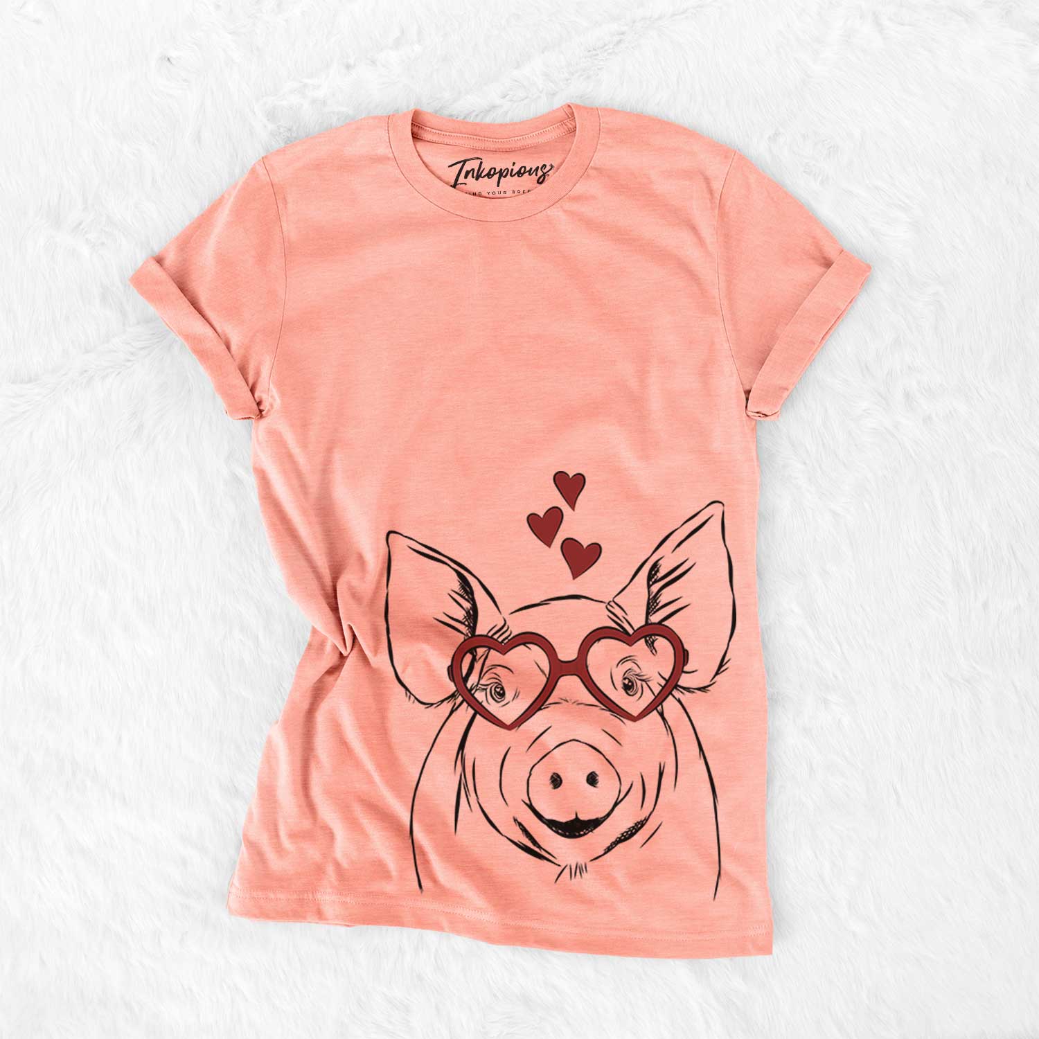 Hand-drawn sketch of Perry the Pig wearing heart-shaped glasses on a Sunset Bella Canvas Unisex Crewneck