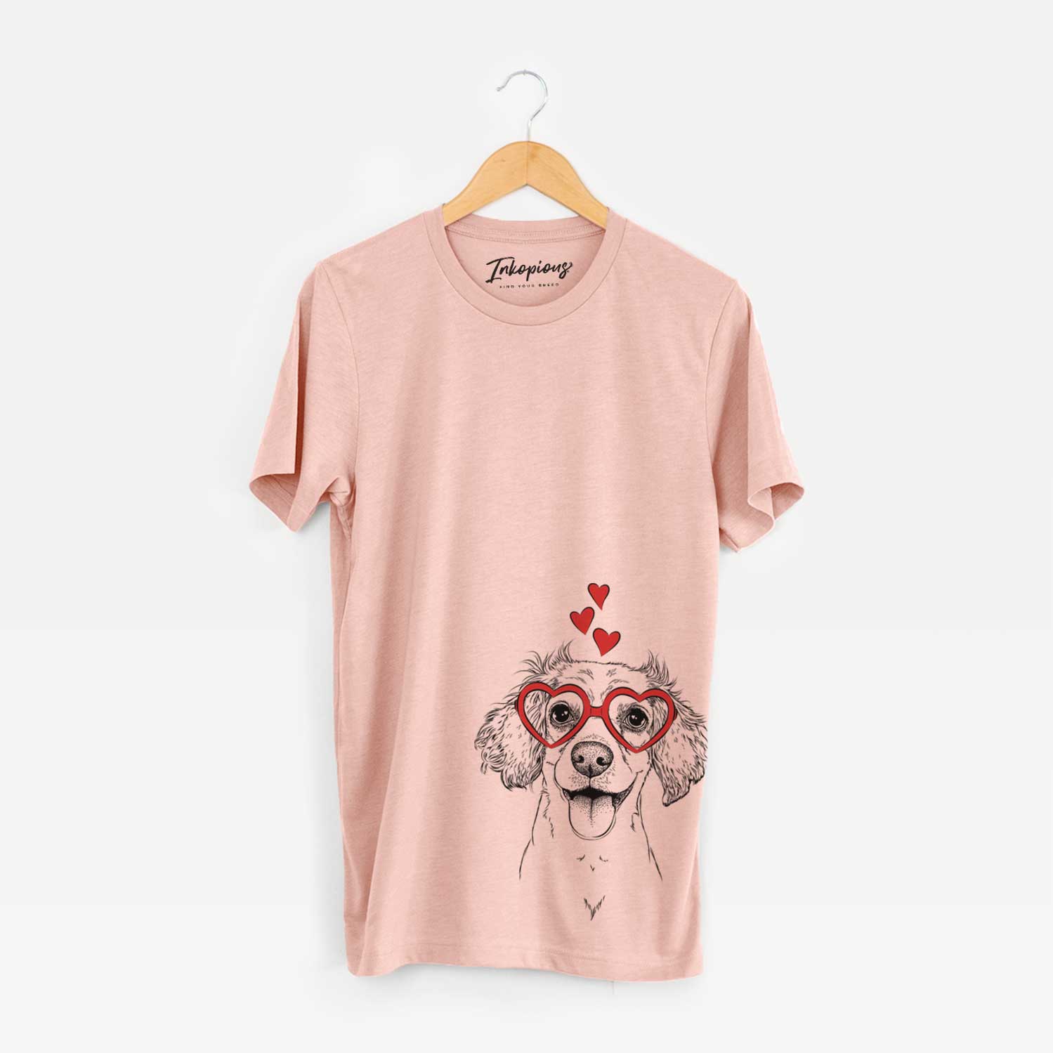 Hand-drawn sketch of Piglet the Dachshund Mix wearing heart-shaped glasses on a Peach Unisex crewneck