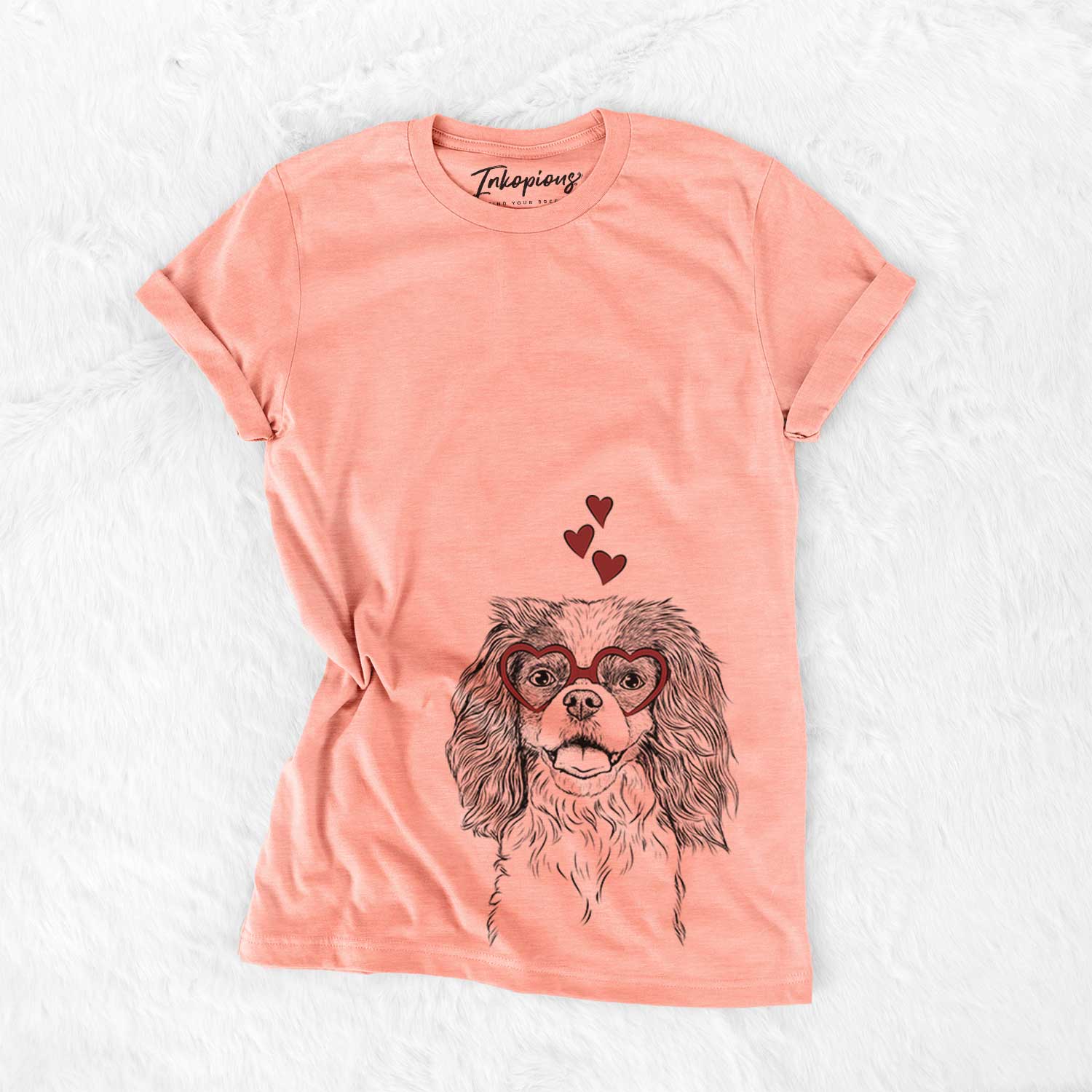 Hand-drawn sketch of Poppy the Cavalier King Charles Spaniel wearing heart-shaped glasses on a Sunset Bella Canvas Unisex Crewneck