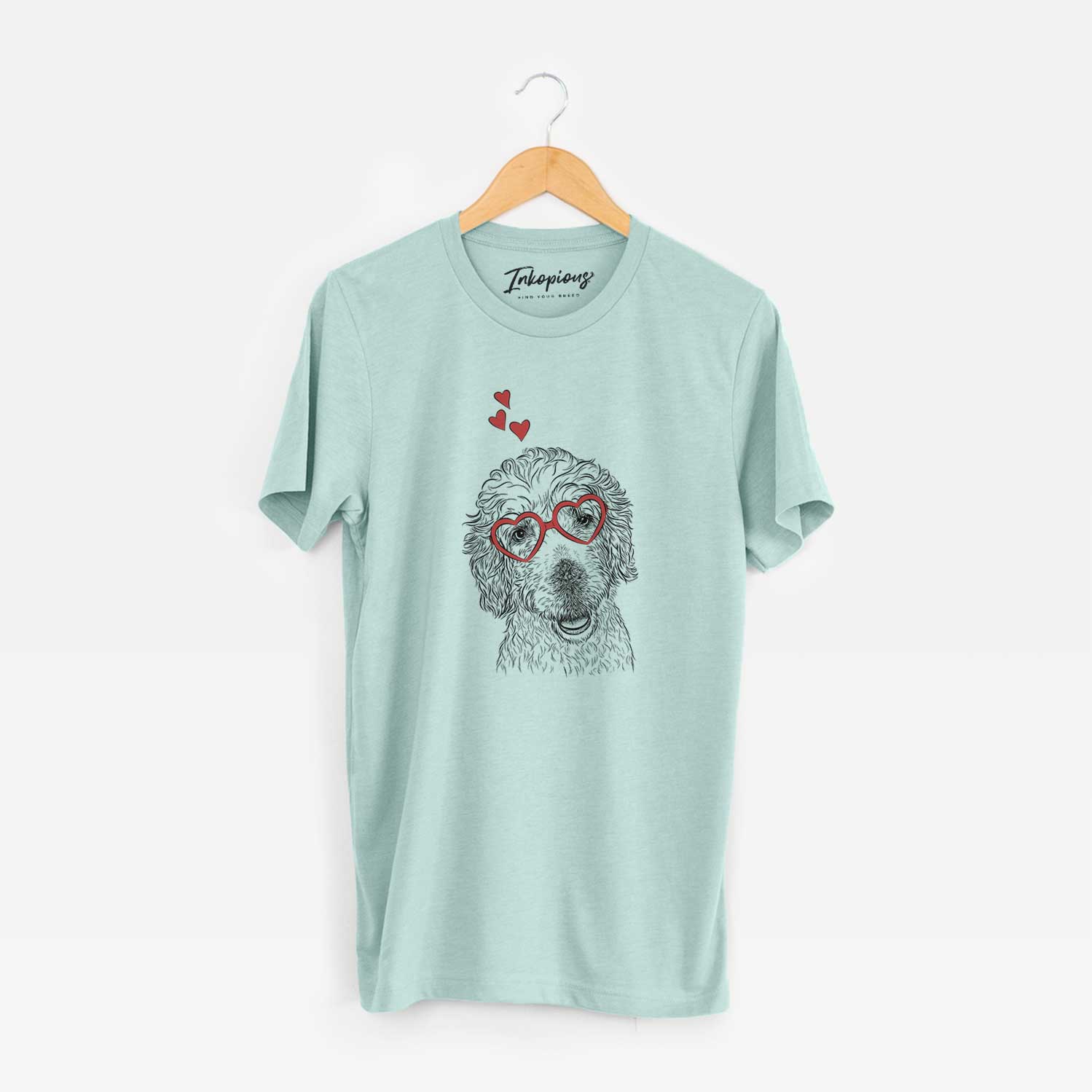 Hand-drawn sketch of Preston the Labradoodle wearing heart-shaped glasses on a Heather Sage Unisex crewneck