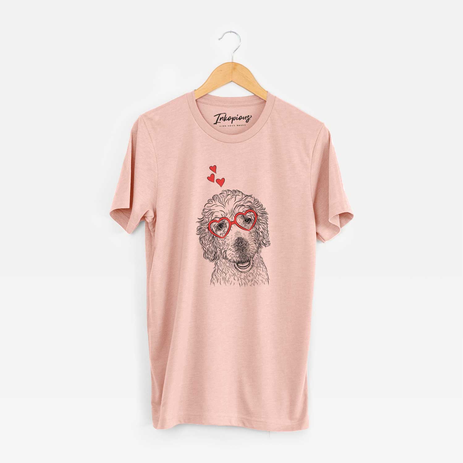 Hand-drawn sketch of Preston the Labradoodle wearing heart-shaped glasses on a Peach Unisex crewneck