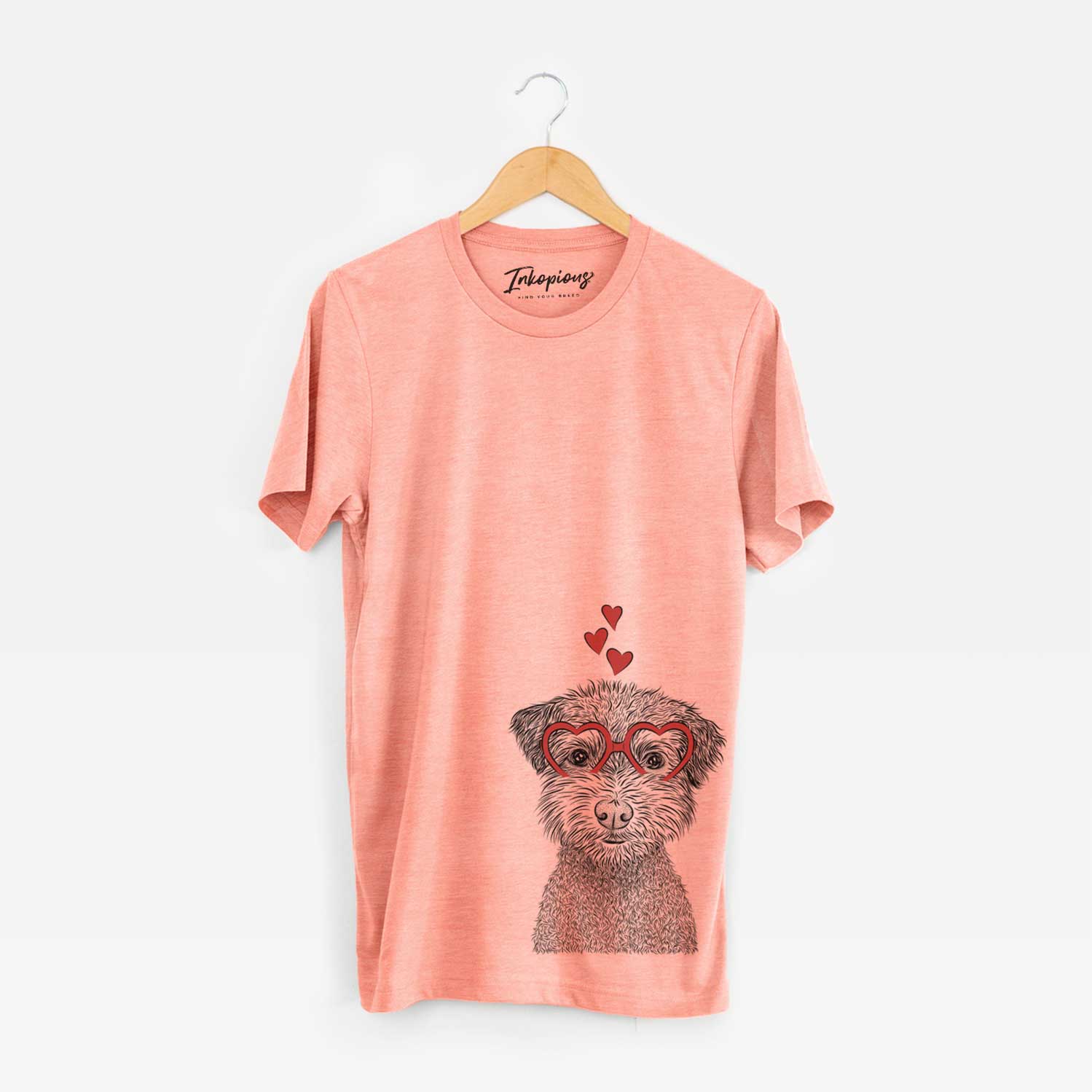 Hand-drawn sketch of Pretzel the Schnoodle wearing heart-shaped glasses on a Sunset Unisex crewneck