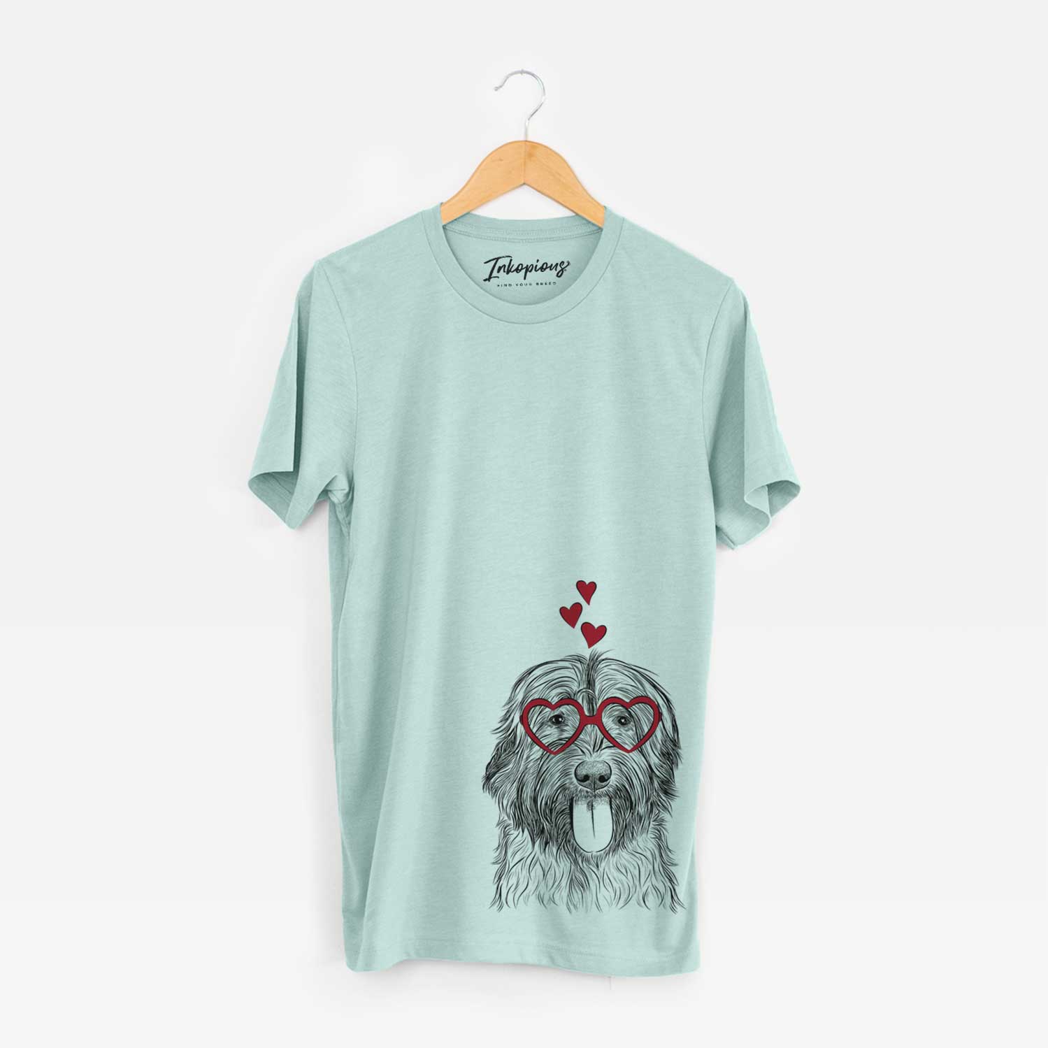 Hand-drawn sketch of Puig the Catalan Sheepdog wearing heart-shaped glasses on a Heather Sage Bella Canvas Unisex Crewneck
