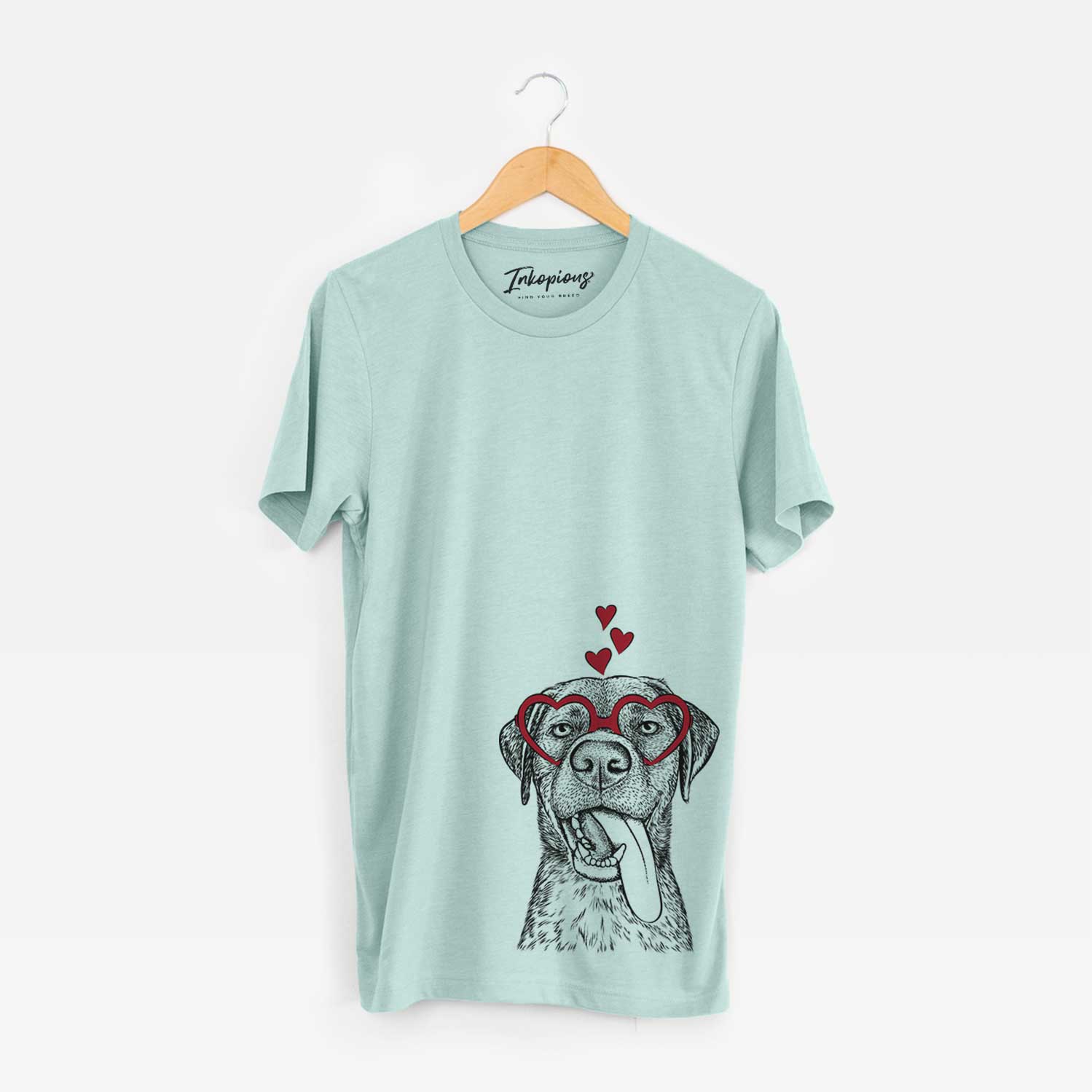 Hand-drawn sketch of Reese the Mixed Breed wearing heart-shaped glasses on a Heather Sage Bella Canvas Unisex Crewneck