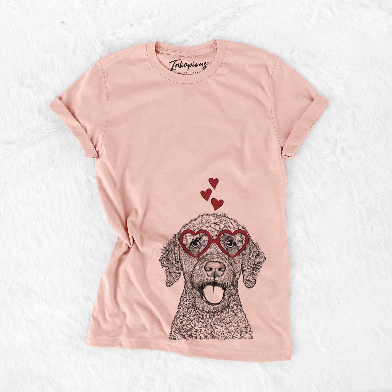 Hand-drawn sketch of Reina the Spanish Water Dog wearing heart-shaped glasses on a Peach Bella Canvas Unisex Crewneck