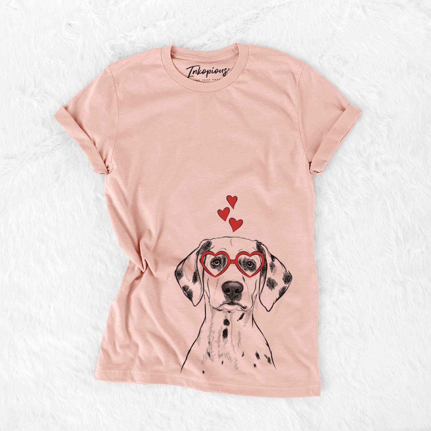 Hand-drawn sketch of Riot the Dalmatian wearing heart-shaped glasses on a Peach Bella Canvas Unisex Crewneck