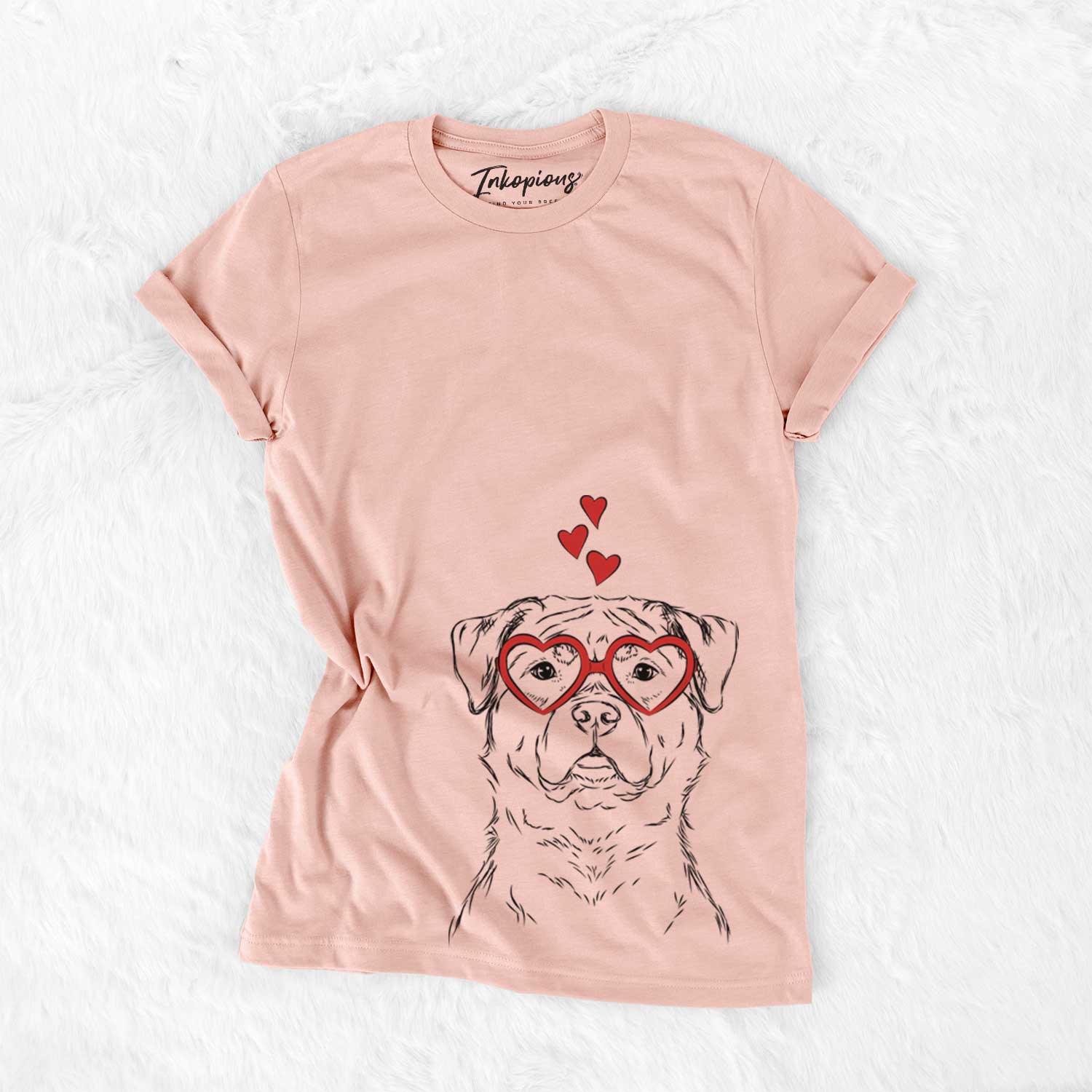Hand-drawn sketch of Rocky the Rottweiler wearing heart-shaped glasses on a Peach Bella Canvas Unisex Crewneck