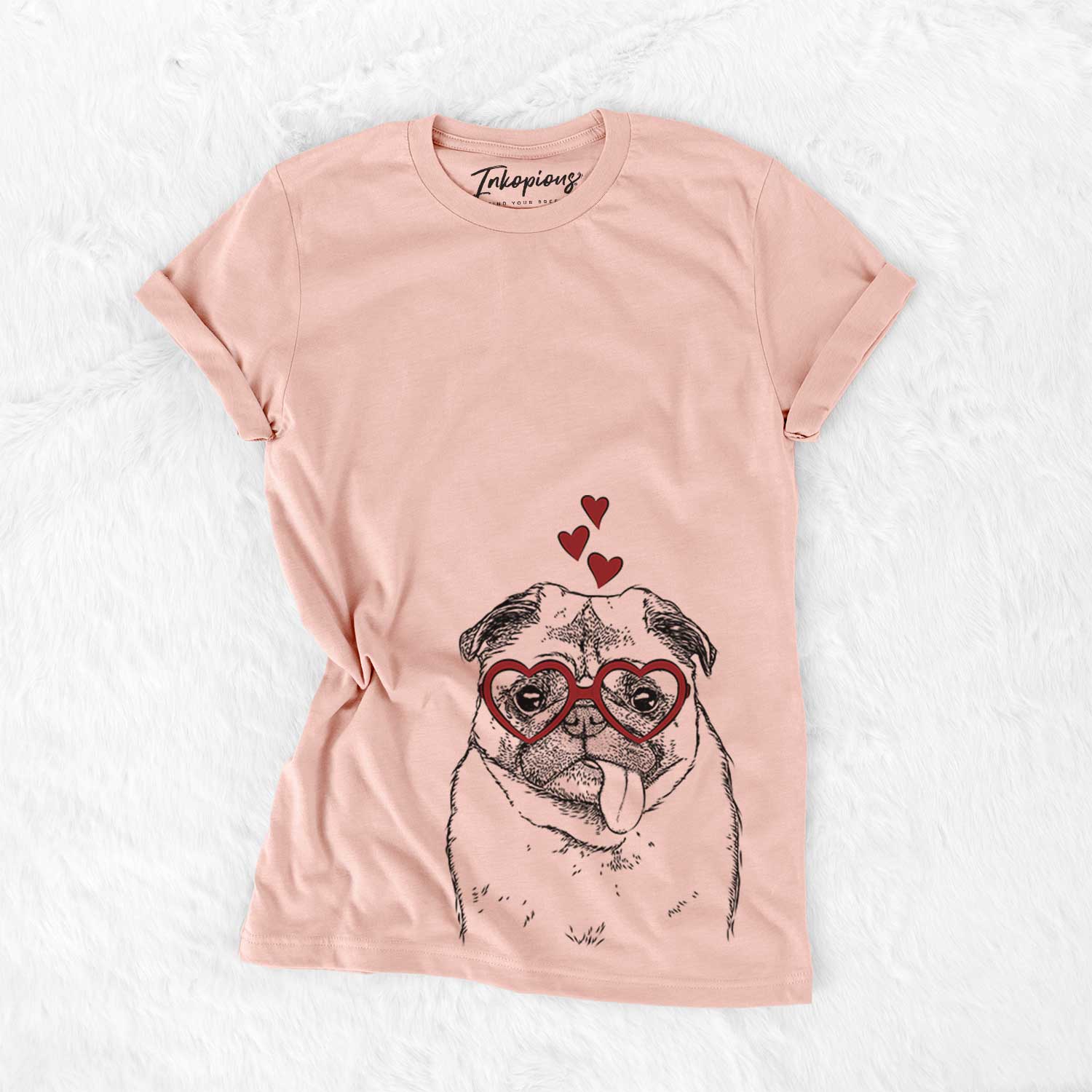 Hand-drawn sketch of Rosie the Pug wearing heart-shaped glasses on a Peach Bella Canvas Unisex Crewneck